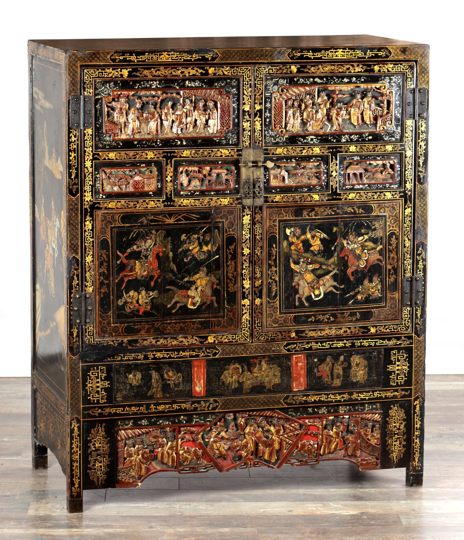 A LATE 19TH CENTURY CHINESE INLAID BLACK LACQUER CABINET WITH RELIEF CARVED GILT PANELS (1 of 16)
