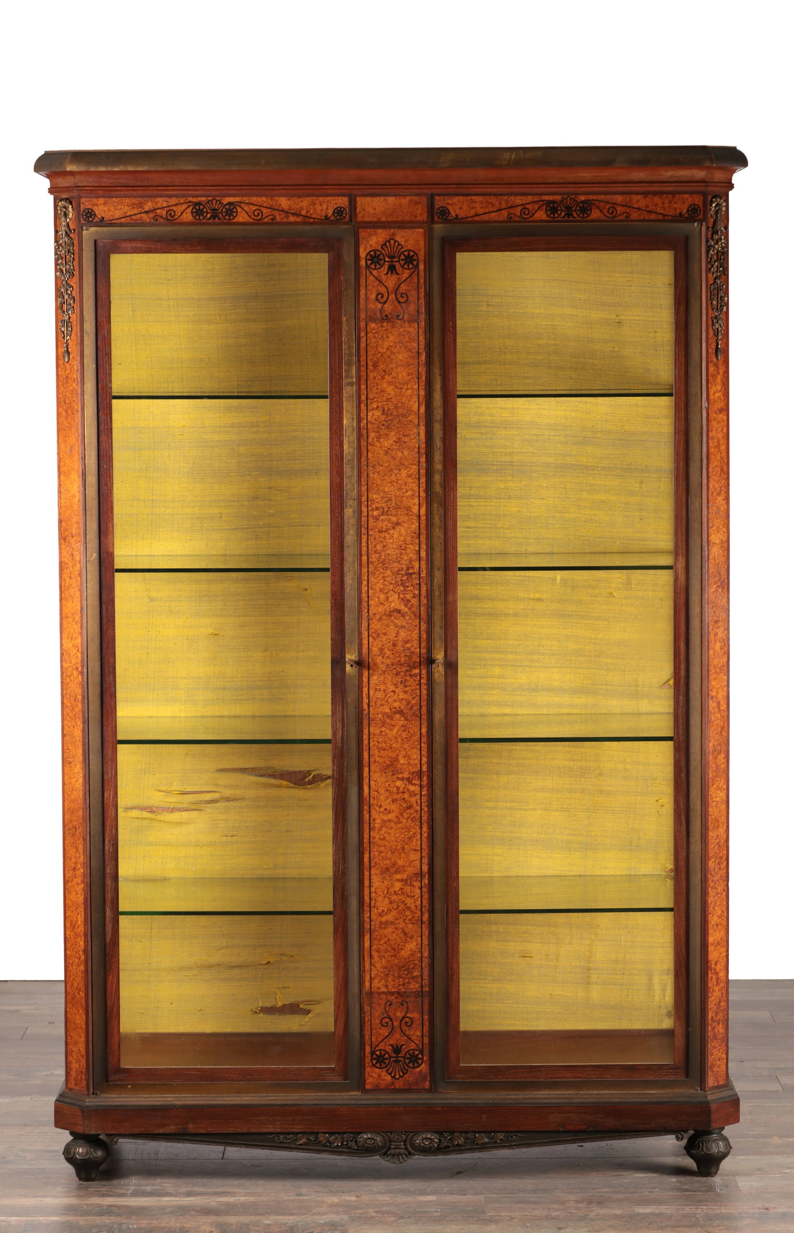 A FINE LATE 19TH CENTURY FRENCH ORMOLU MOUNTED AND EBONY STRUNG AMBOINA AND MAHOGANY DISPLAY CABINET: A FINE LATE 19TH CENTURY FRENCH ORMOLU MOUNTED AND EBONY STRUNG AMBOINA AND MAHOGANY DISPLAY CABINET IN THE MANNER OF FRANCOIS LINKE the projecting moulded cornice above twin glazed doors flanking a m