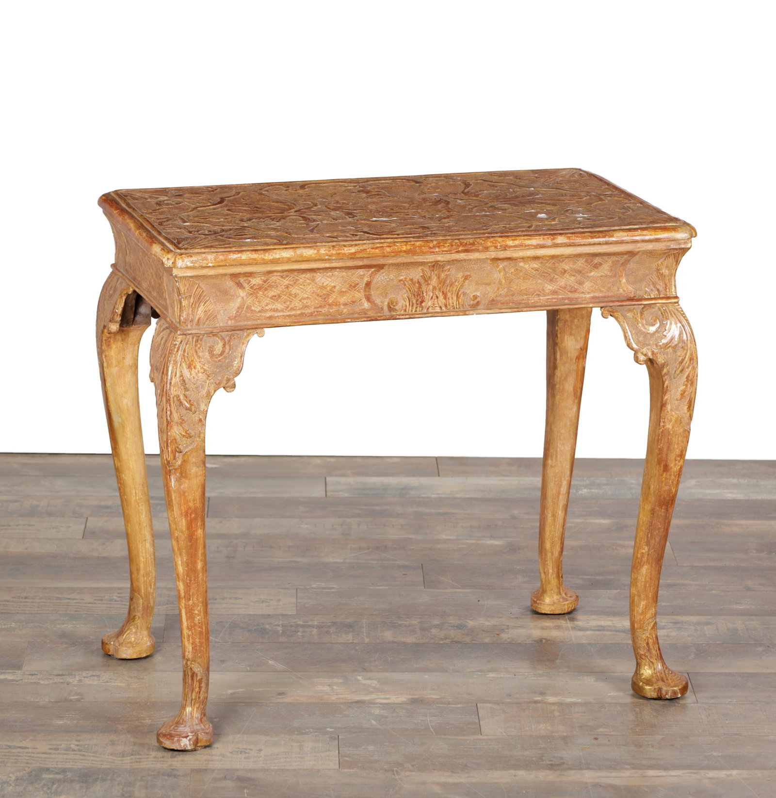 A GEORGE I GILT GESSO SIDE TABLE: A GEORGE I GILT GESSO SIDE TABLE with rectangular top carved with foliate strapwork, moulded edge above a shaped frieze with shell and diaper panels and corner scrolls, raised on cabriole legs with ca