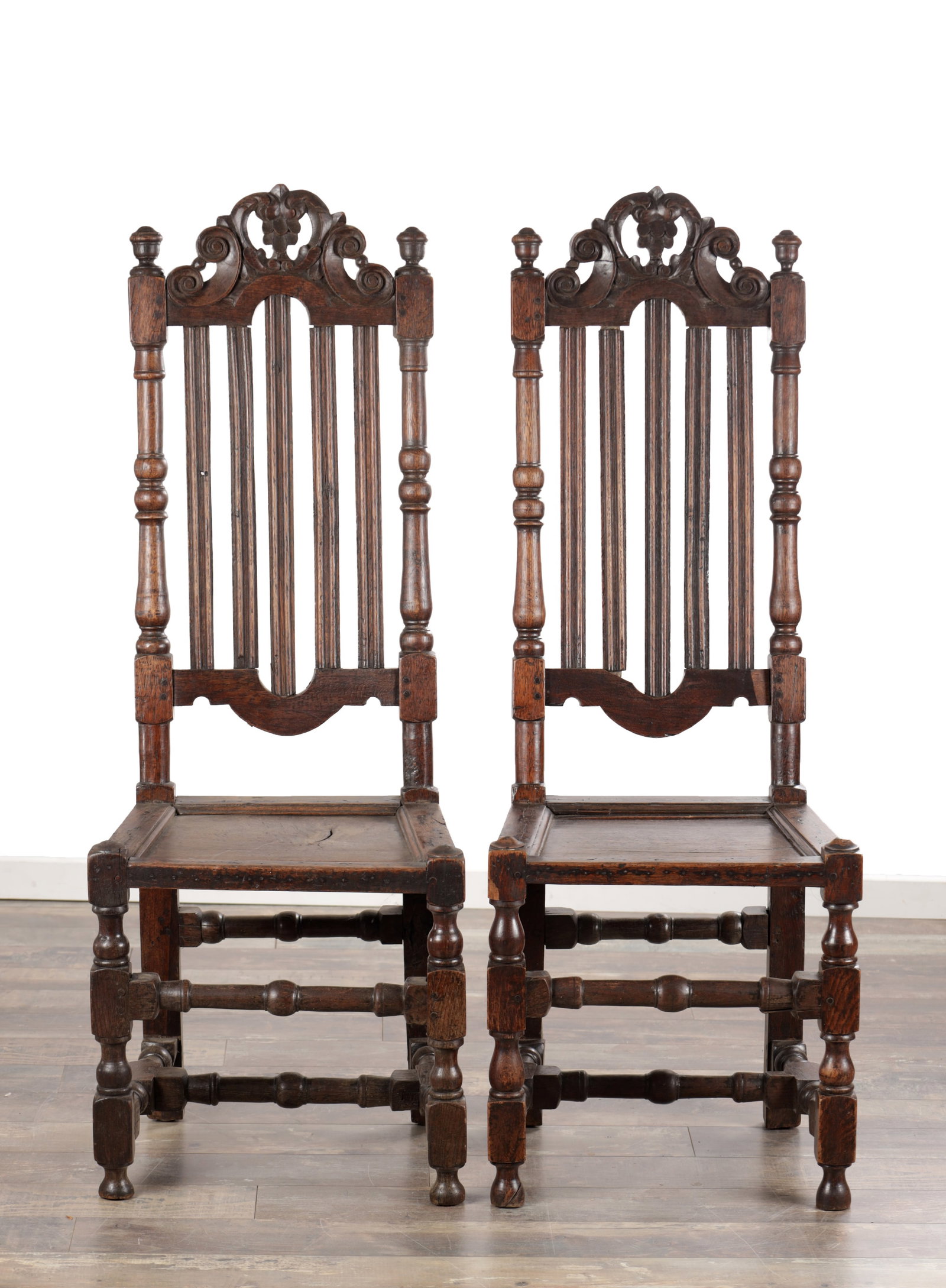 A PAIR OF 17TH CENTURY ENGLISH OAK HALL CHAIRS (1 of 9)