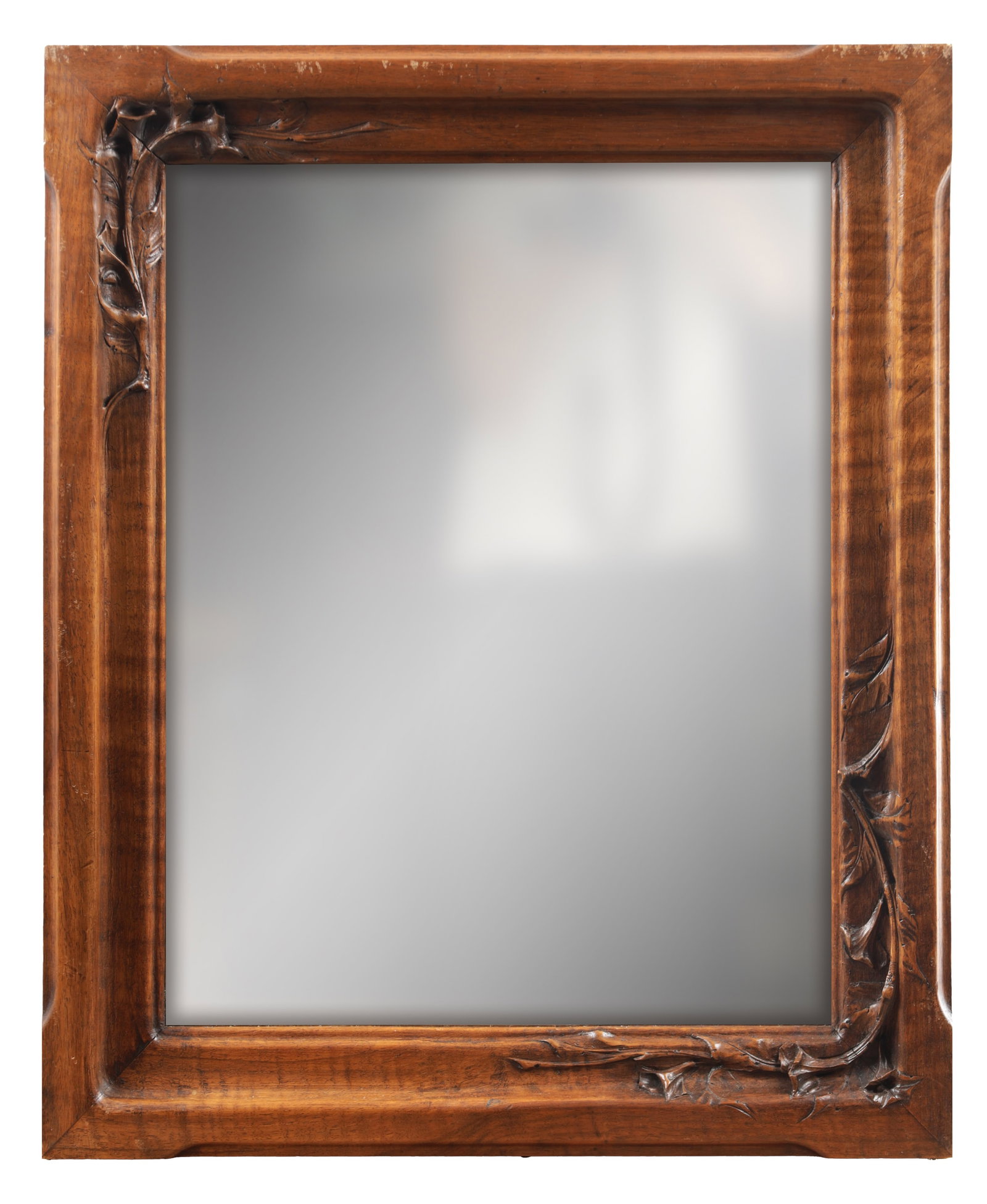 AN EARLY 20TH CENTURY FRENCH ART NOUVEAU CARVED WALNUT HANGING MIRROR: AN EARLY 20TH CENTURY FRENCH ART NOUVEAU CARVED WALNUT HANGING MIRROR of rectangular form with a plain plate within a moulded frame carved with sinuous foliate corners and trailing stems. (64cm high, 