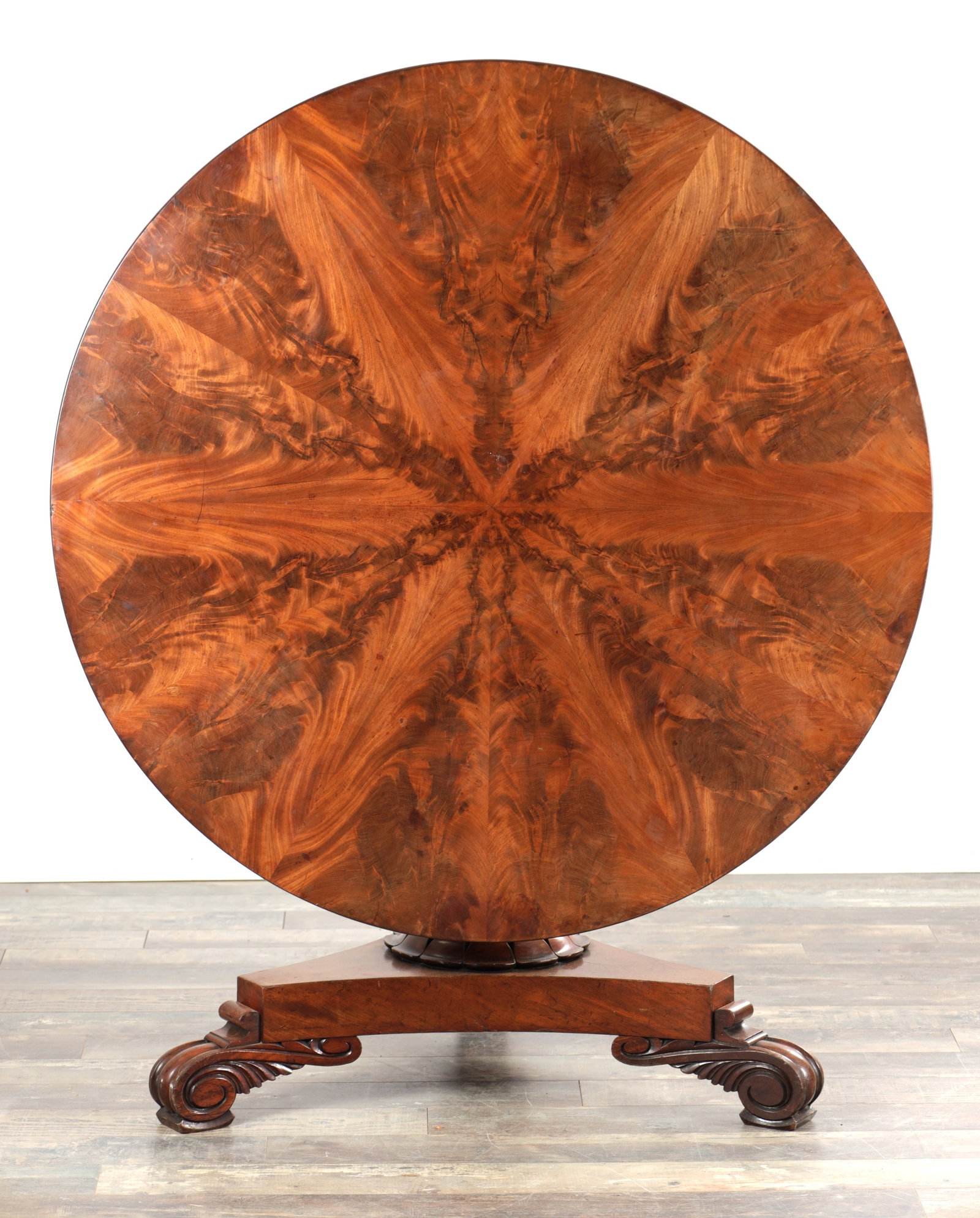 A WILLIAM IV FLAMED MAHOGANY CIRCULAR TABLE WITH A SEGMENTED FANNED TOP (1 of 7)
