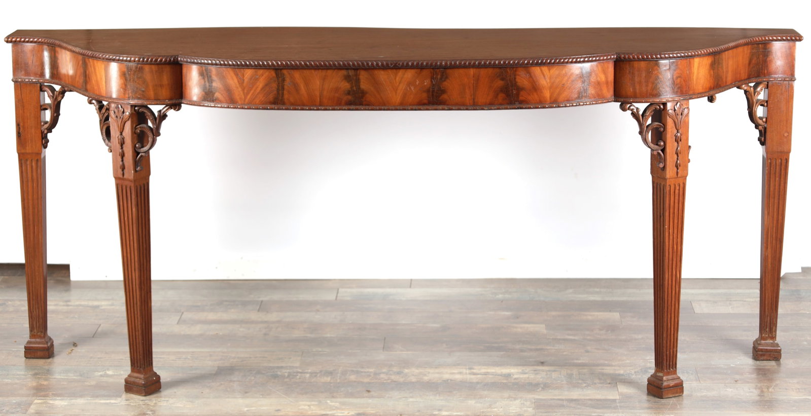 A GEORGE III FIGURED MAHOGANY SERPENTINE SERVING TABLE (1 of 10)