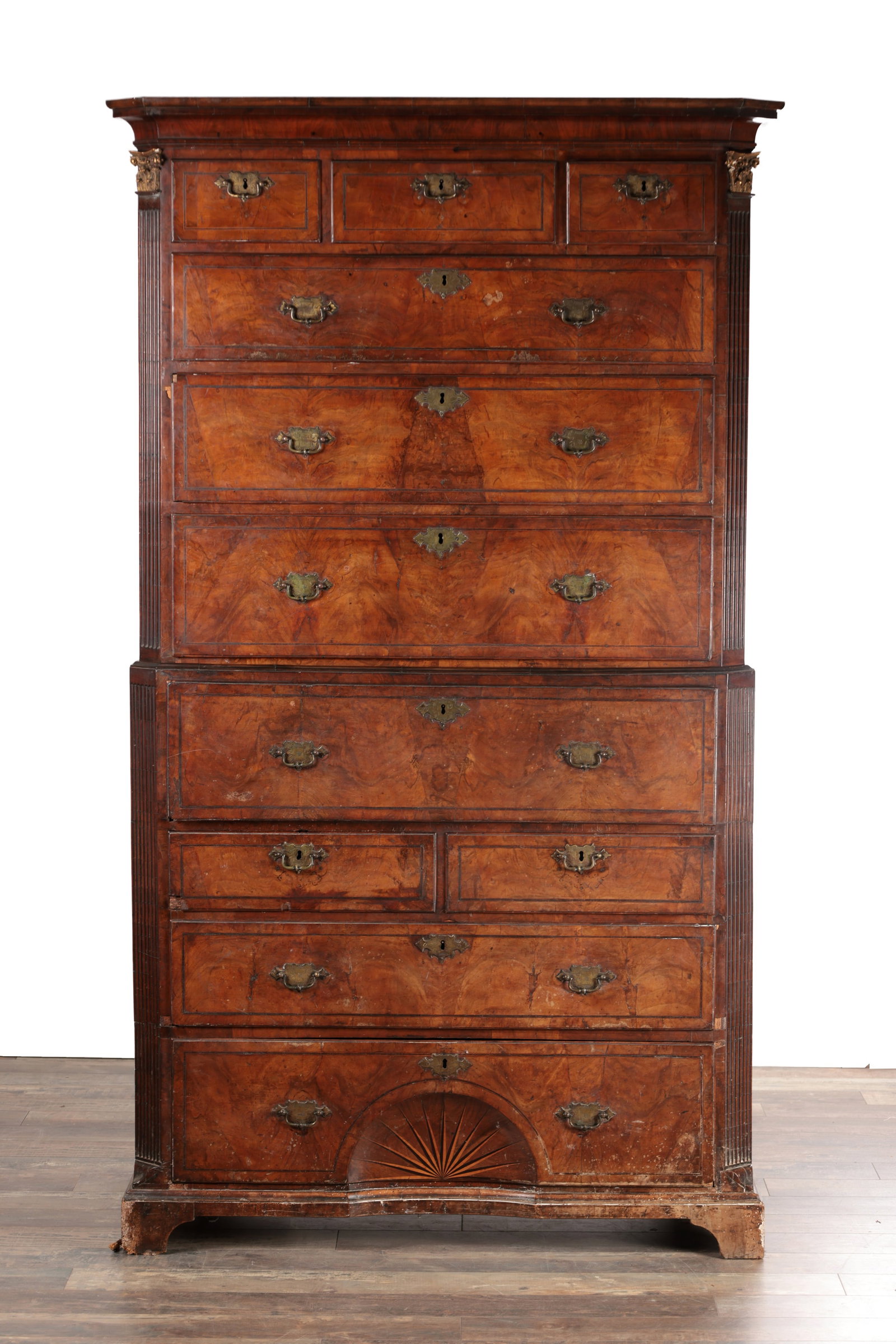 A GOOD EARLY 18TH CENTURY FIGURED WALNUT SECRETAIRE CHEST ON CHEST WITH STARBURST INLAID BASE: A GOOD EARLY 18TH CENTURY FIGURED WALNUT SECRETAIRE CHEST ON CHEST WITH STARBURST INLAID BASE with a moulded cornice above an upper section of short and long graduated drawers and a lower section