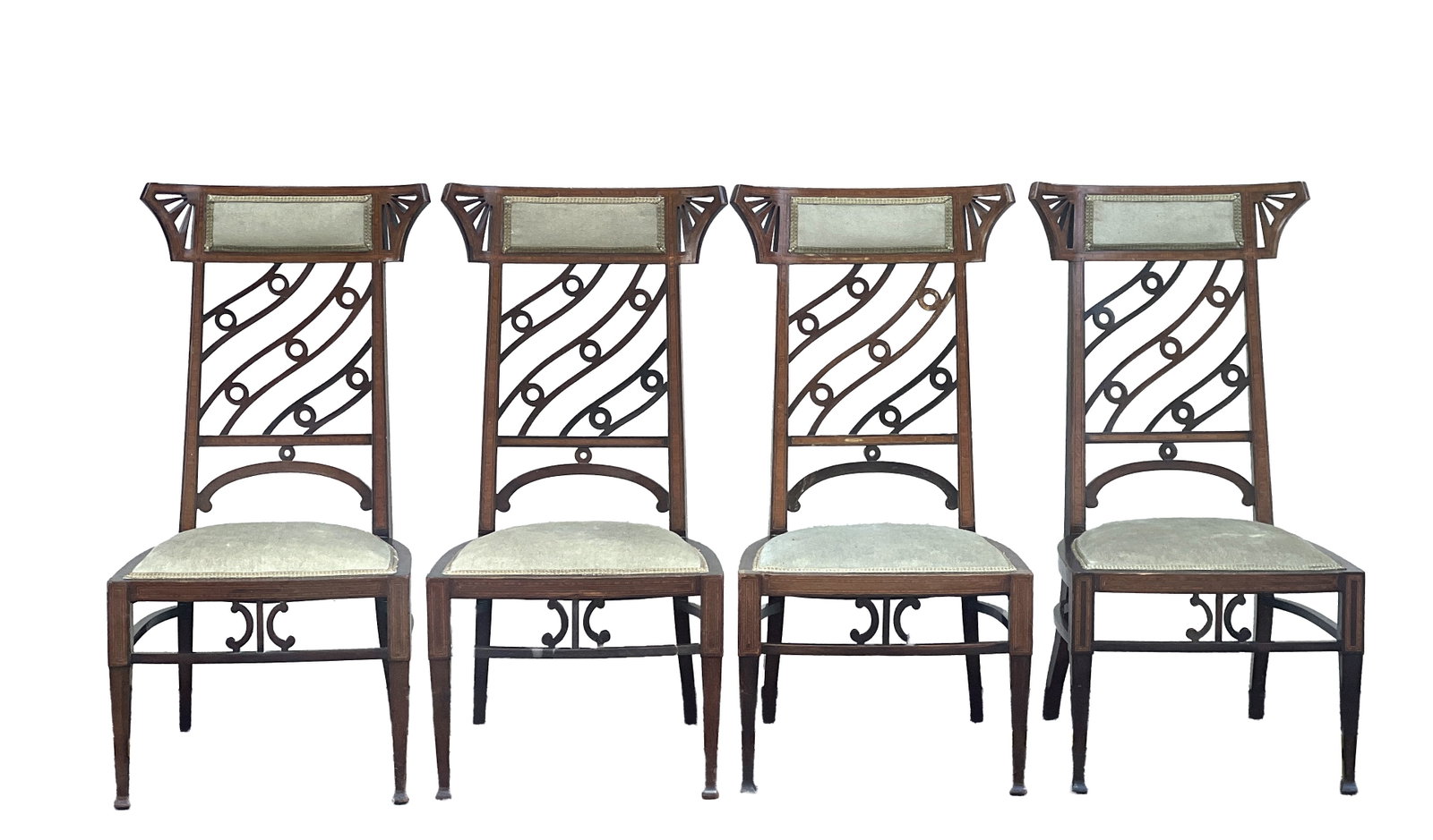 A SET OF FOUR EARLY 20TH CENTURY MAHOGANY INLAID DINING CHAIRS: A SET OF FOUR EARLY 20TH CENTURY MAHOGANY INLAID DINING CHAIRS each with a rectangular top rail centred by an upholstered panel within a frame with fan-shaped pierced corners, above a splat of curved