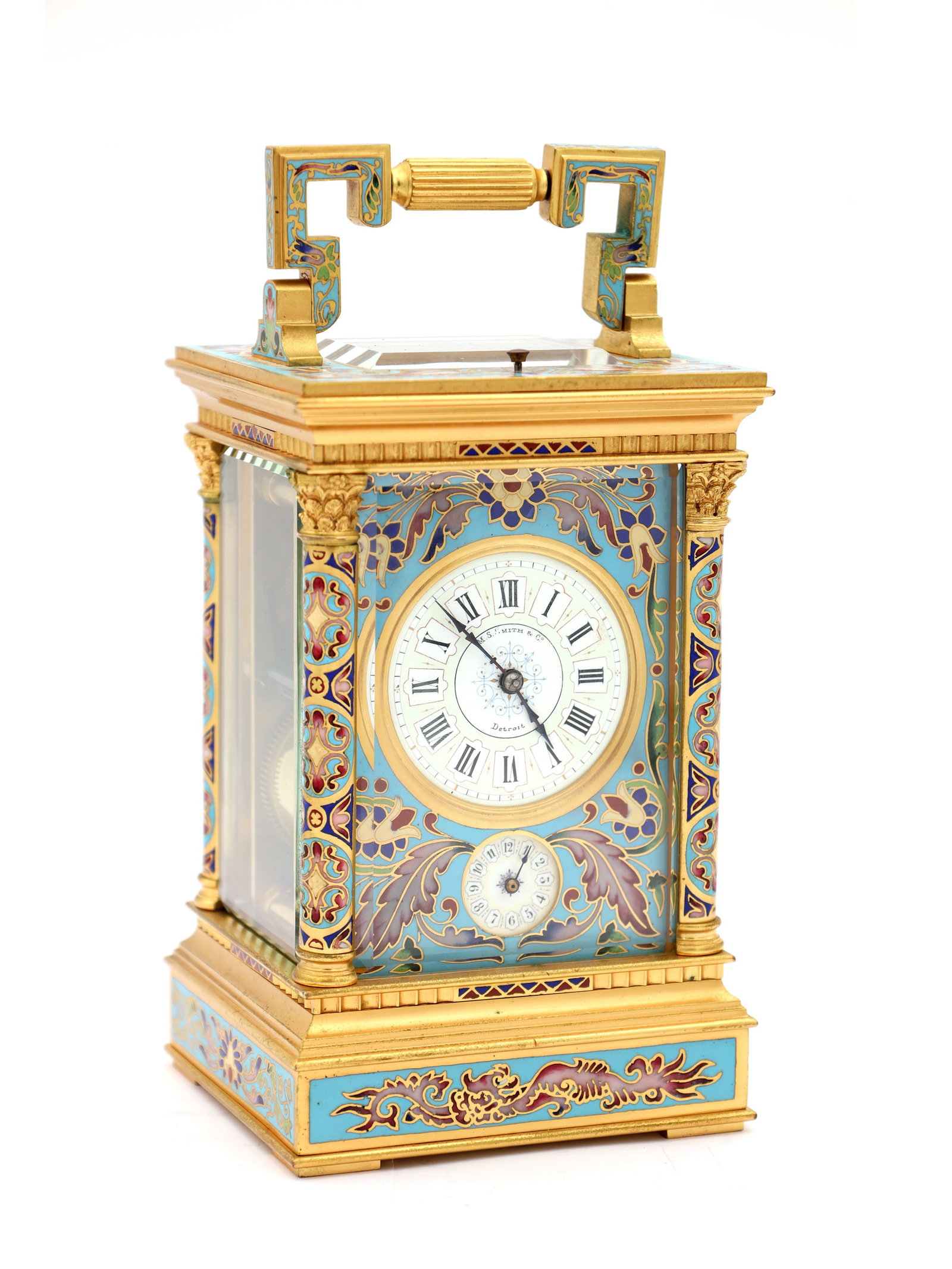 A LATE 19TH CENTURY FRENCH CHAMPLEVE ENAMEL REPEATING CARRIAGE CLOCK: A LATE 19TH CENTURY FRENCH CHAMPLEVE ENAMEL REPEATING CARRIAGE CLOCK with gilt brass case decorated in turquoise, red and blue enamel panels, Corinthian columns and a folding handle, enclosing a maske