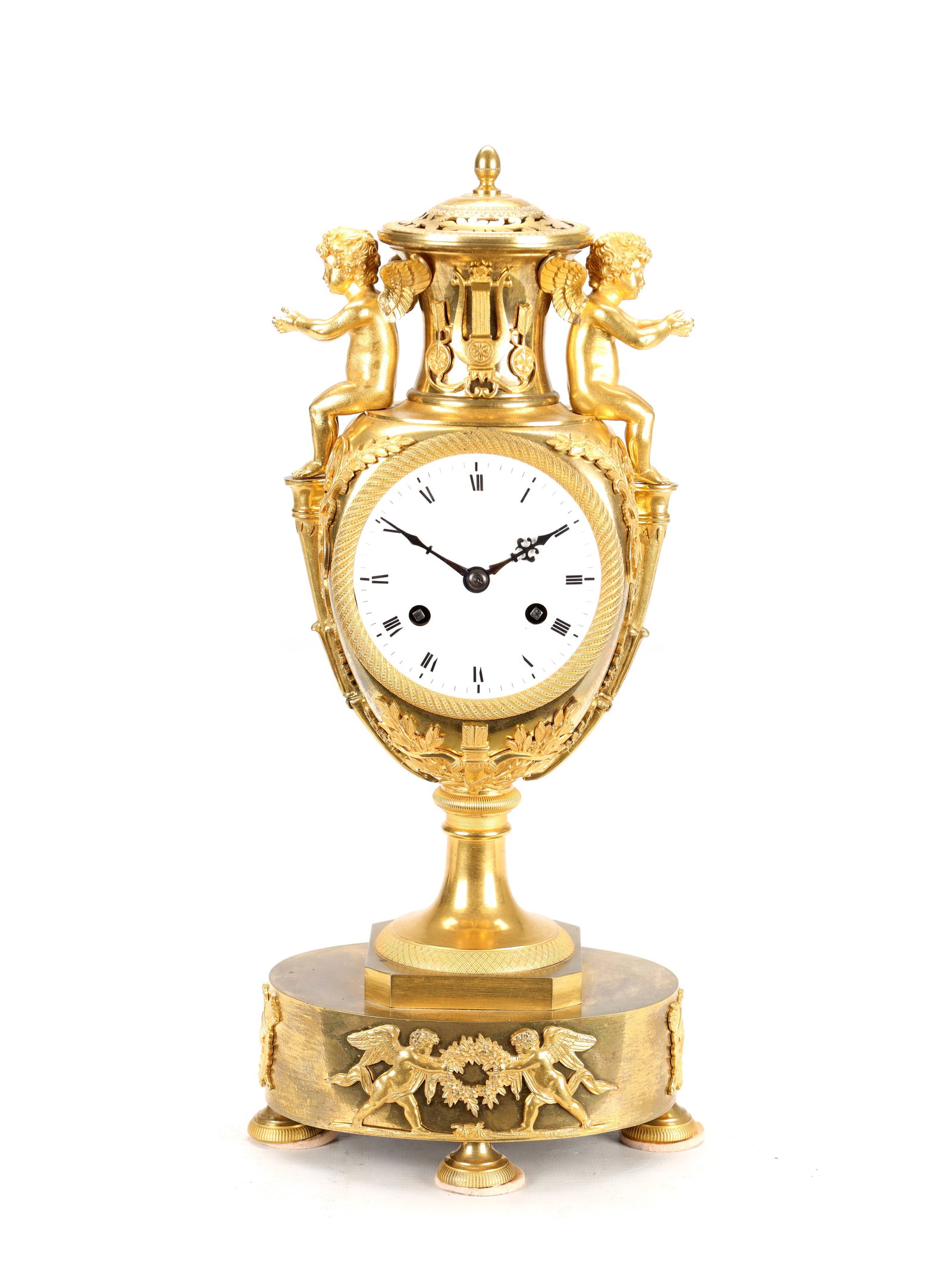 AN EARLY 19TH CENTURY FRENCH ORMOLU URN-FORM MANTEL CLOCK WITH PUTTI MOUNTS (1 of 9)