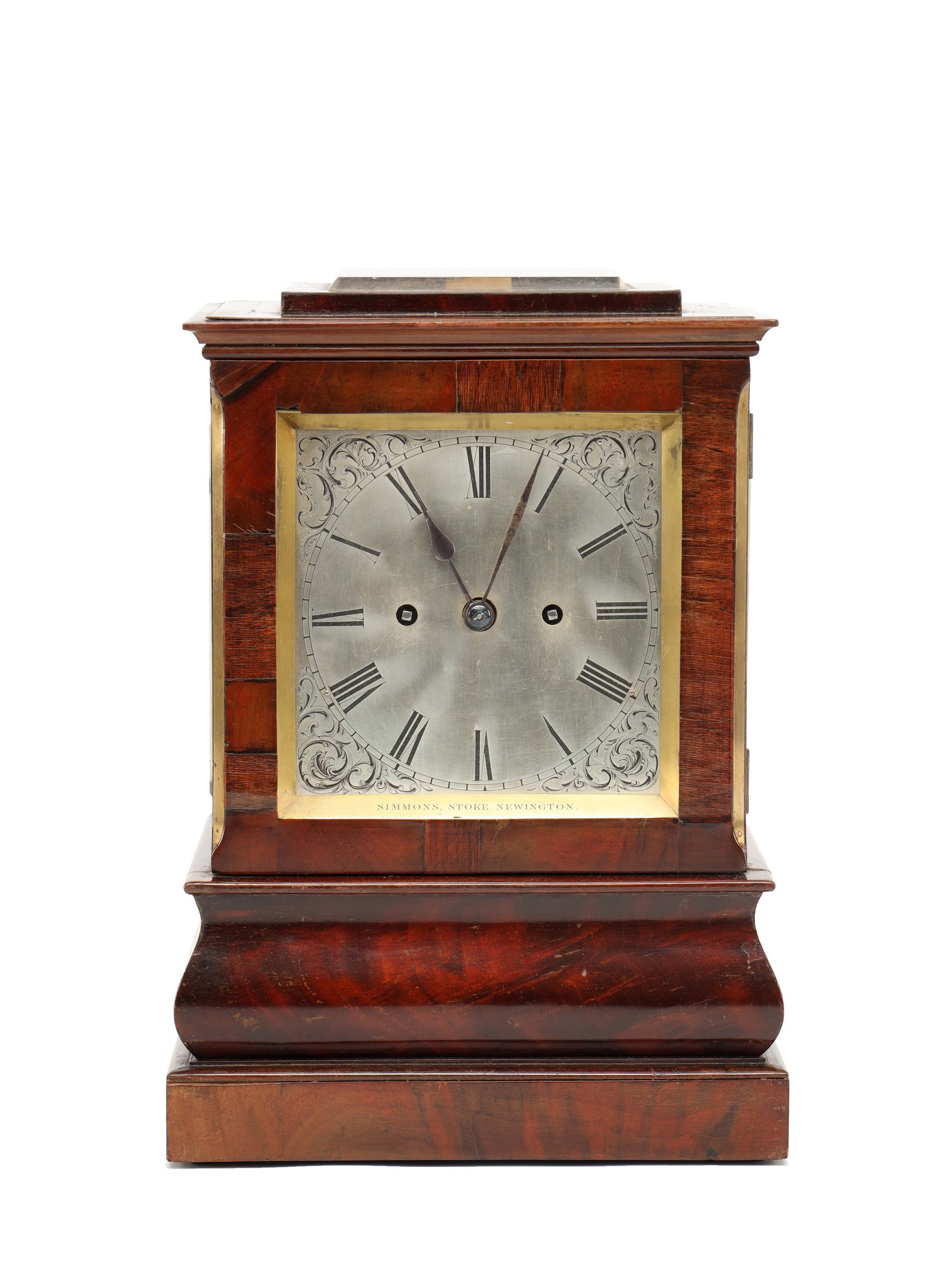 SIMMONS, STOKE NEWINGTON A REGENCY FIGURED MAHOGANY DOUBLE FUSEE FOUR-GLASS BRACKET CLOCK: SIMMONS, STOKE NEWINGTON A REGENCY FIGURED MAHOGANY DOUBLE FUSEE FOUR-GLASS BRACKET CLOCK with a rectangular figured case on a stepped plinth enclosing a 5 1/2' silvered dial with Roman numerals withi