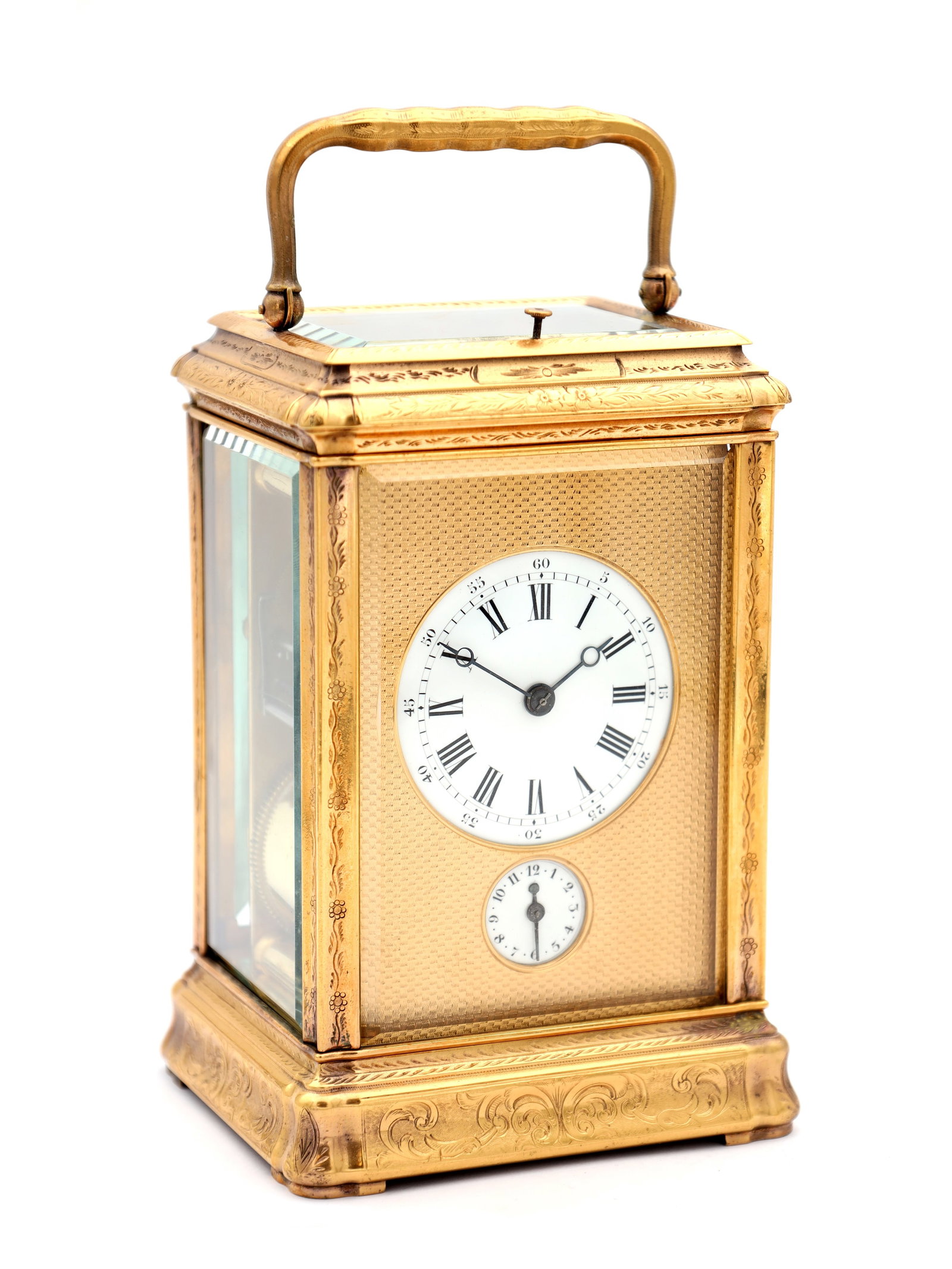 ATT. HENRI JACOT. A LATE 19TH CENTURY FRENCH GORGE ENGRAVED GRAND SONNERIE CARRIAGE CLOCK: ATT. HENRI JACOT. A LATE 19TH CENTURY FRENCH GORGE ENGRAVED GRAND SONNERIE CARRIAGE CLOCK having an engraved gilt brass case with bevelled glass panels, enclosing an engine turned gilt masked enamel R