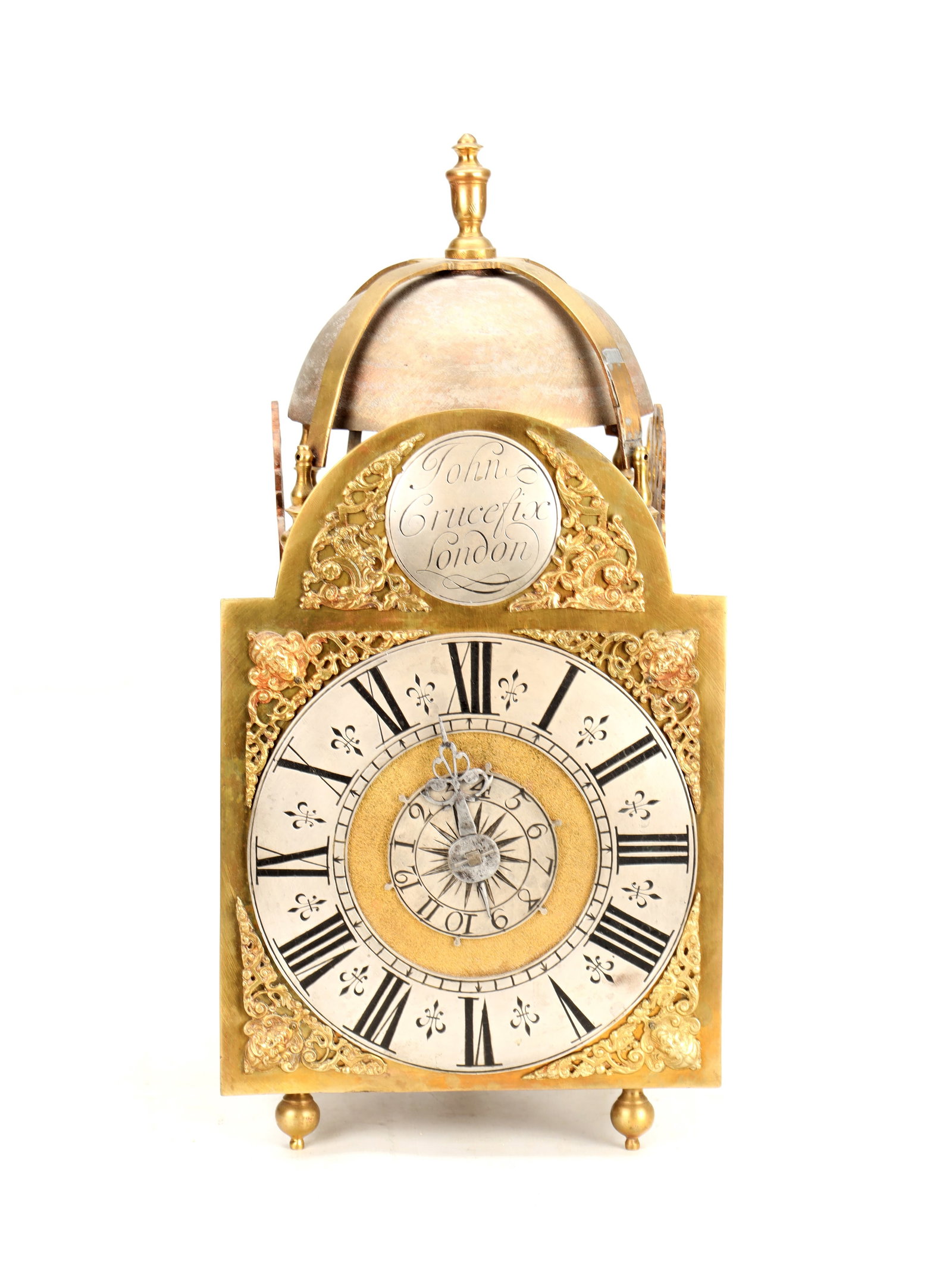 JOHN CRUCEFIX, LONDON. AN EARLY 18TH CENTURY ARCHED BRASS DIAL LANTERN CLOCK WITH ALARM: JOHN CRUCEFIX, LONDON. AN EARLY 18TH CENTURY ARCHED BRASS DIAL LANTERN CLOCK WITH ALARM the brass case surmounted by a domed bell and finial, enclosing a 7' arched dial with silvered chapter ring with