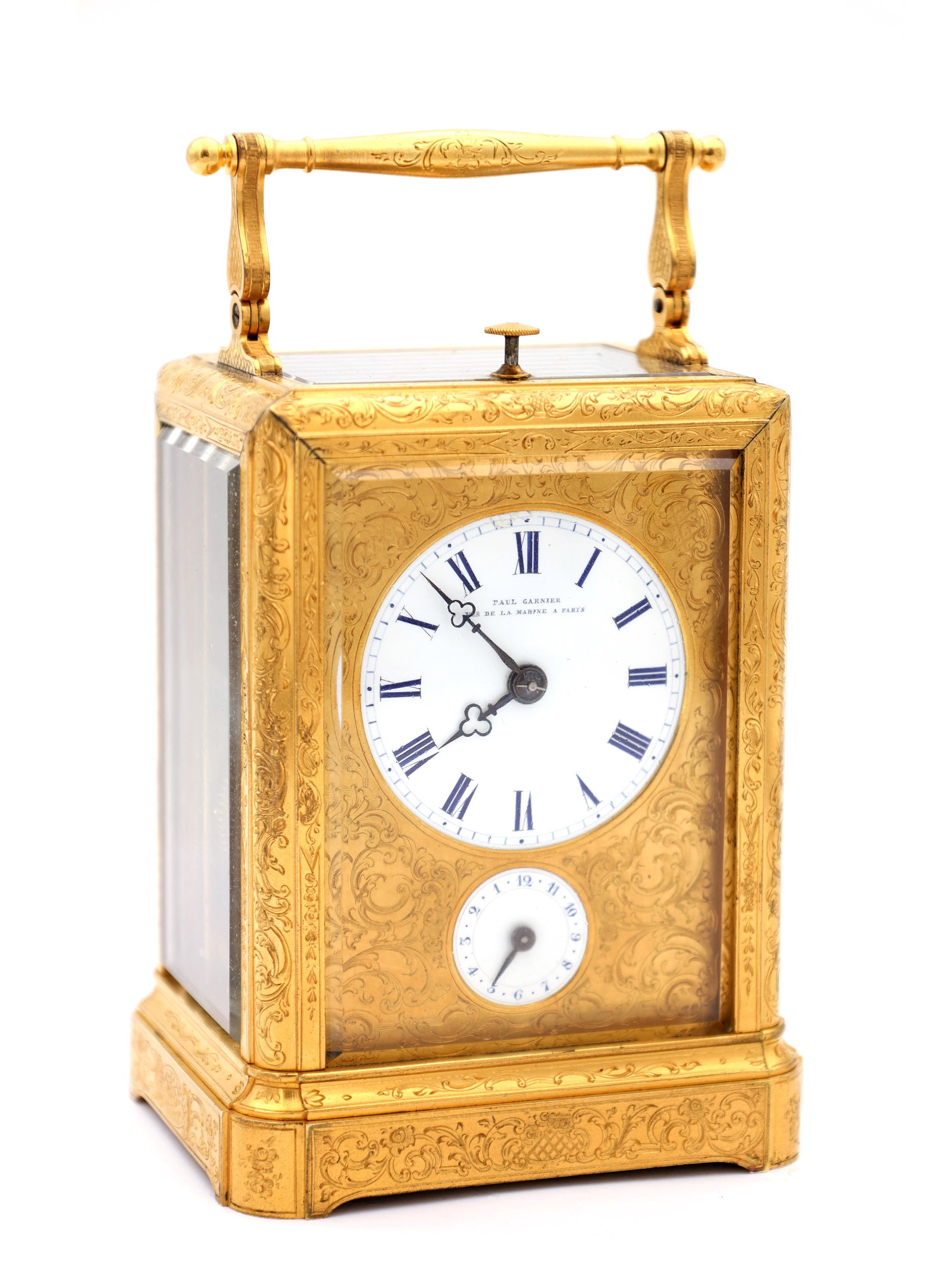 PAUL GARNIER. A MID 19TH CENTURY FRENCH ENGRAVED GILT BRASS REPEATING CARRIAGE CLOCK: PAUL GARNIER. A MID 19TH CENTURY FRENCH ENGRAVED GILT BRASS REPEATING CARRIAGE CLOCK having a one-piece case with bevelled glass panels, swing handle, shuttered back door and shaped plinth base, enclo