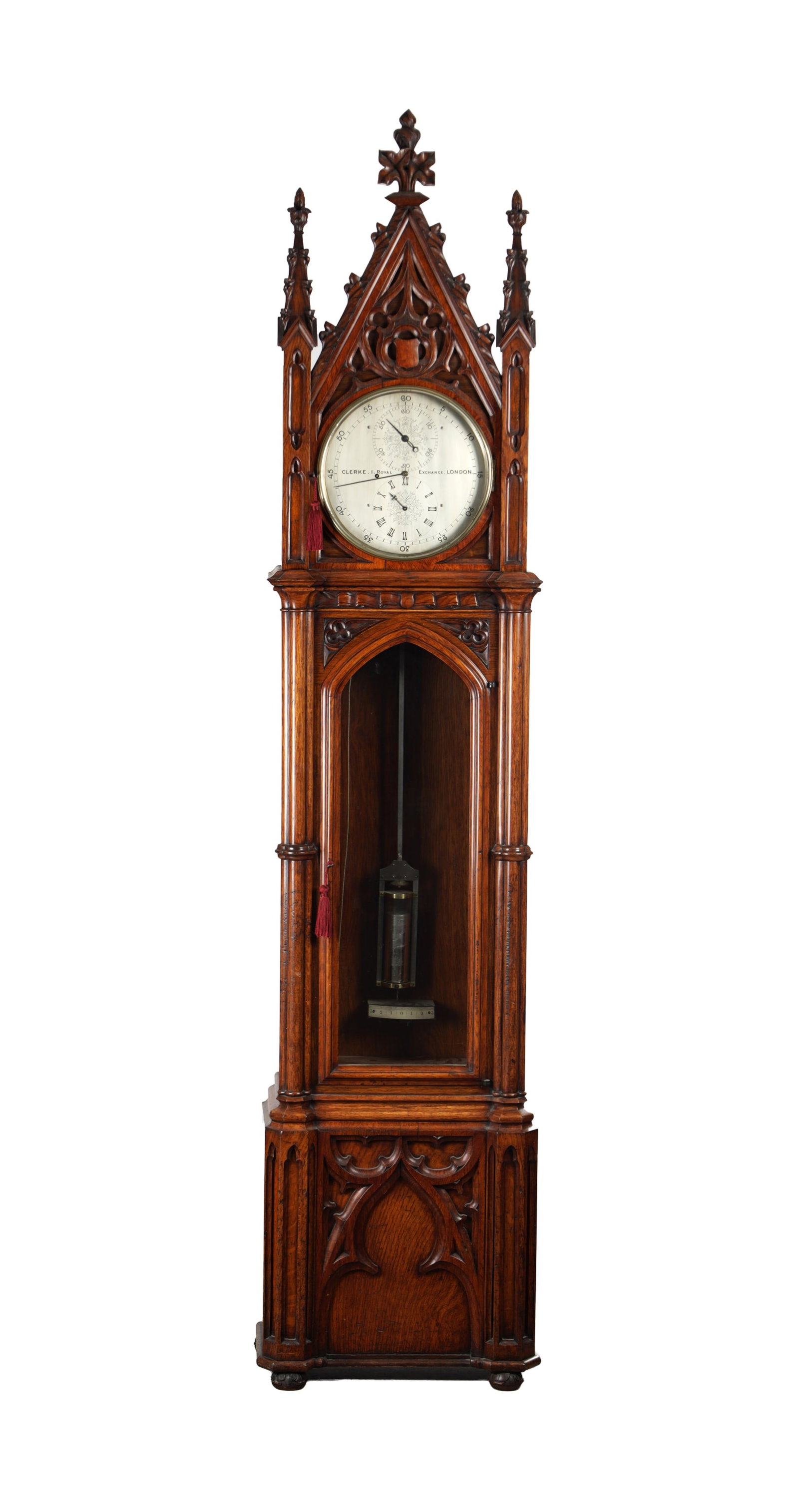 CLERKE, 1 ROYAL EXCHANGE, LONDON. A FINE CARVED OAK GOTHIC STYLE REGULATOR LONGCASE CLOCK IN THE: CLERKE, 1 ROYAL EXCHANGE, LONDON. A FINE CARVED OAK GOTHIC STYLE REGULATOR LONGCASE CLOCK IN THE MANNER OF PUGIN with an architectural hood carved with tracery and crocketed spire finials above the ar