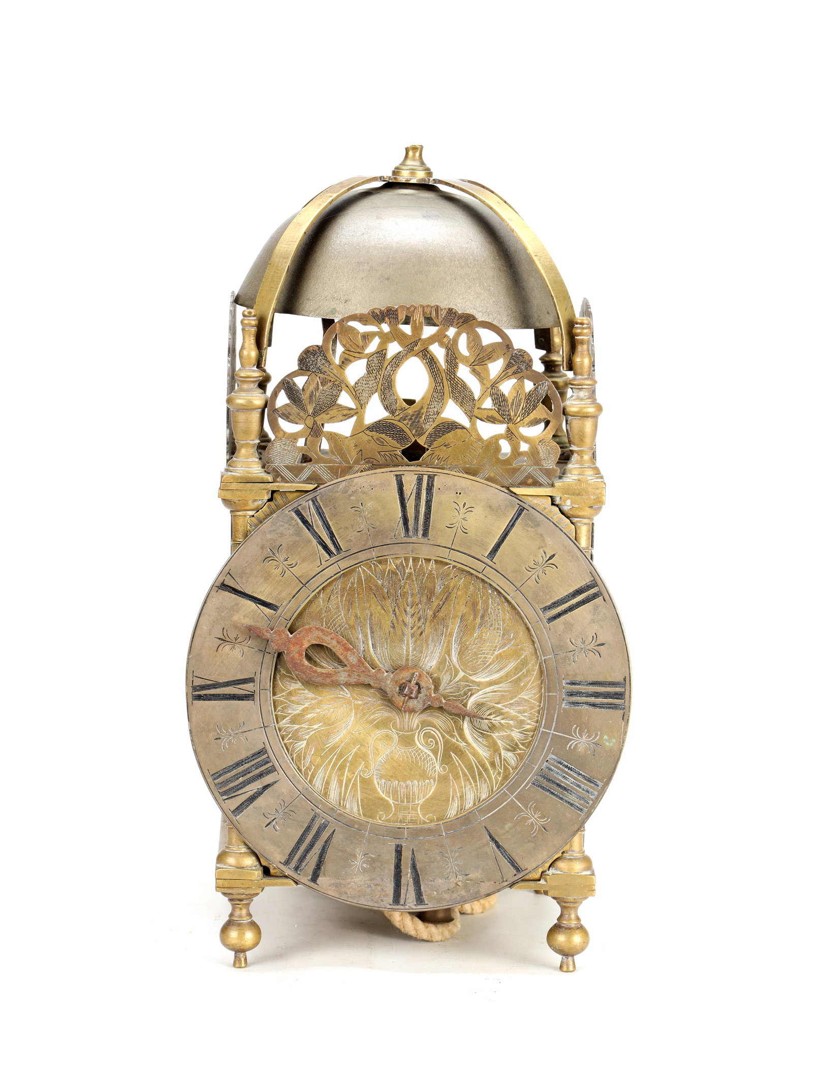 A LATE 17TH CENTURY ENGLISH BRASS LANTERN CLOCK: A LATE 17TH CENTURY ENGLISH BRASS LANTERN CLOCK of posted frame construction with pierced foliate frets, turned finials and ball feet, surmounted by a domed bell; enclosing a 6.5' silver chapter ring 