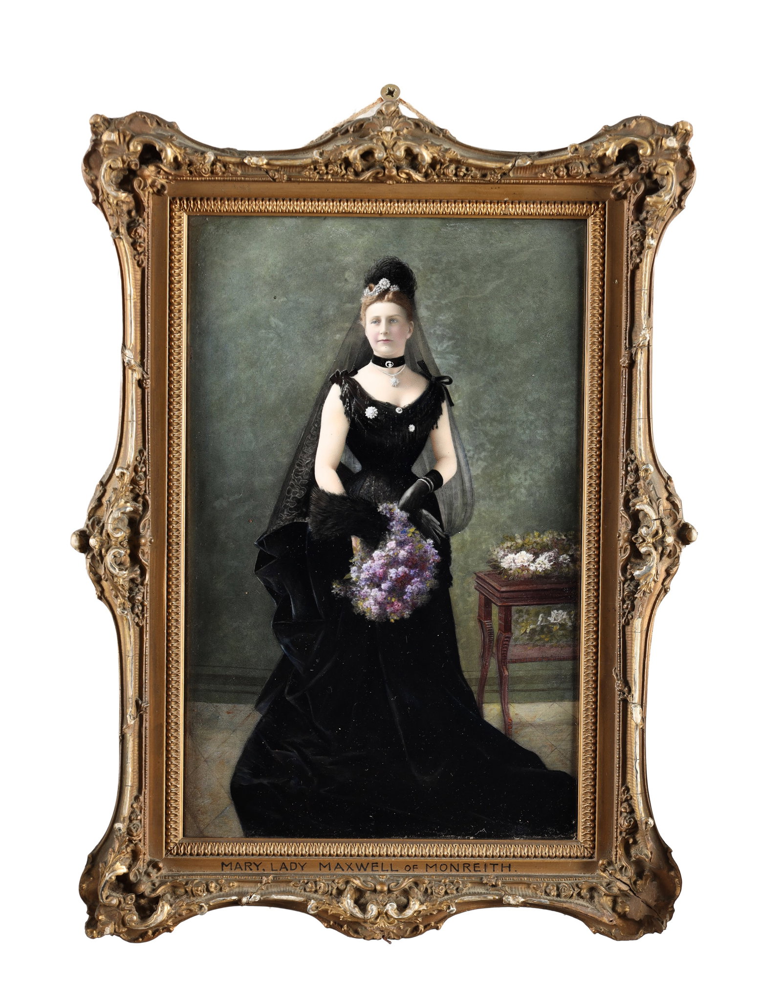 A LARGE EARLY 20TH CENTURY FRENCH LIMOGES ENAMEL FULL LENGTH PORTRAIT OF LADY MARY MAXWELL OF: A LARGE EARLY 20TH CENTURY FRENCH LIMOGES ENAMEL FULL LENGTH PORTRAIT OF LADY MARY MAXWELL OF MONREITH depicting the sitter in a black gown holding flowers, inscribed below, mounted in a gilt swept fr