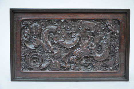 A Chinese panel in hardwood 'dragons' (43x26cm): A Chinese panel in hardwood 'dragons' (43x26cm)