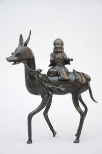 A Chinese bronze statue 'Laotsé on a deer' (*): A Chinese bronze statue 'Laotsé on a deer' (*) (29x35cm)