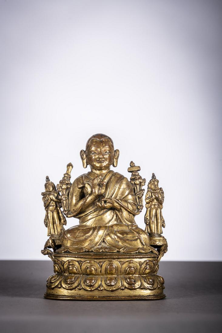 Tibetan gilt bronze sculpture 'lama flanked by (1 of 5)