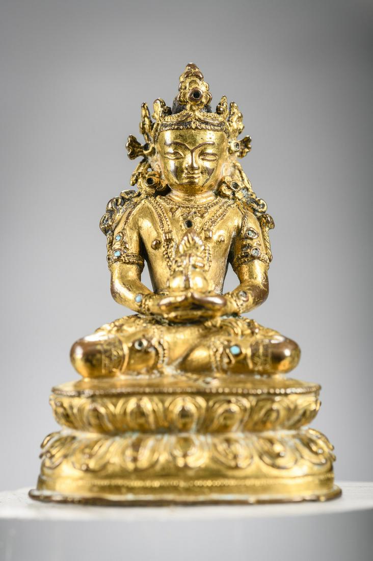 A gilt Nepalese sculpture 'Amitayus' 14th - 15th century (h 9.5 cm): A gilt Nepalese sculpture 'Amitayus' 14th - 15th century (h 9.5 cm)