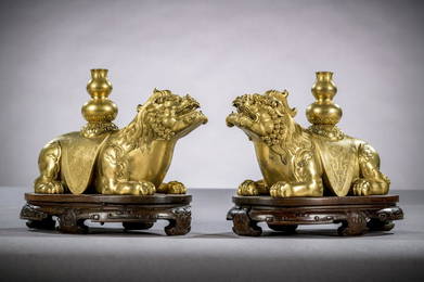 A fine pair of gilt bronze mythical lions on hardwood stands China Qing dynasty (14.5 x 22.5 x 10