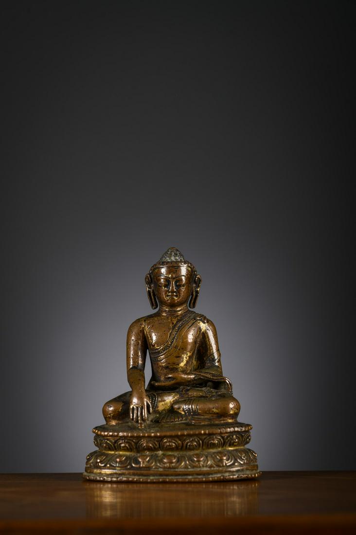 A fine sculpture in gilt bronze 'Buddha Shakyamuni', Tibet or Nepal 14th century (h 9.5 cm) (1 of 5)