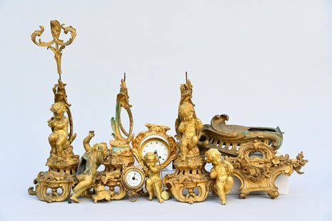 Collection of gilt bronze elements: putti, bells, clockwork holders, supports: Collection of gilt bronze elements: putti, bells, clockwork holders, supports