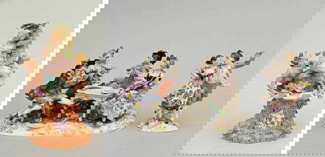 A collection of porcelain sculptures: base (h36cm), dancers (h19cm) and musicians (19.5x32x18cm): A collection of porcelain sculptures: base (h36cm), dancers (h19cm) and musicians (19.5x32x18cm)