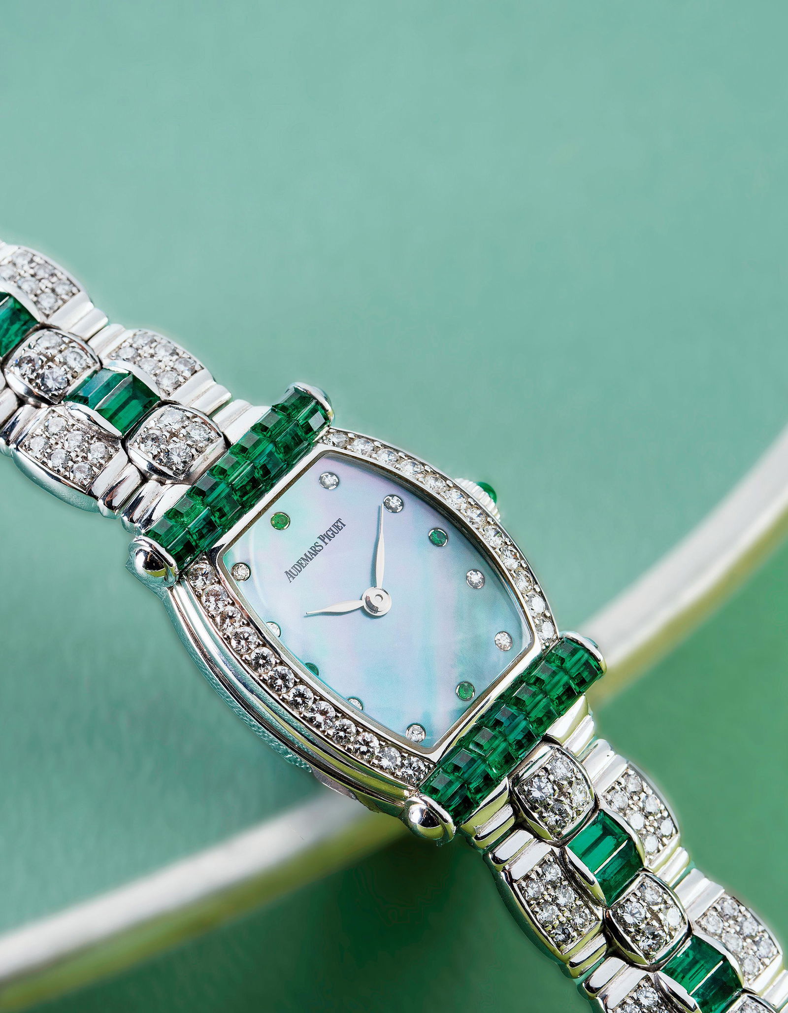 A WHITE GOLD, DIAMOND AND EMERALD-SET MECHANICAL BRACELET WATCH (1 of 1)