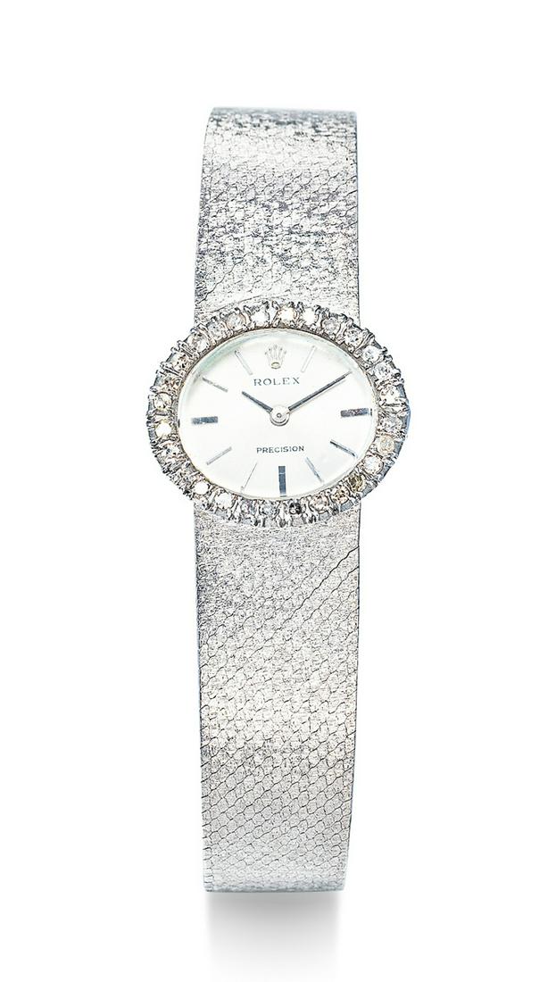 A WHITE GOLD AND DIAMOND-SET MECHANICAL BRACELET WATCH (1 of 1)