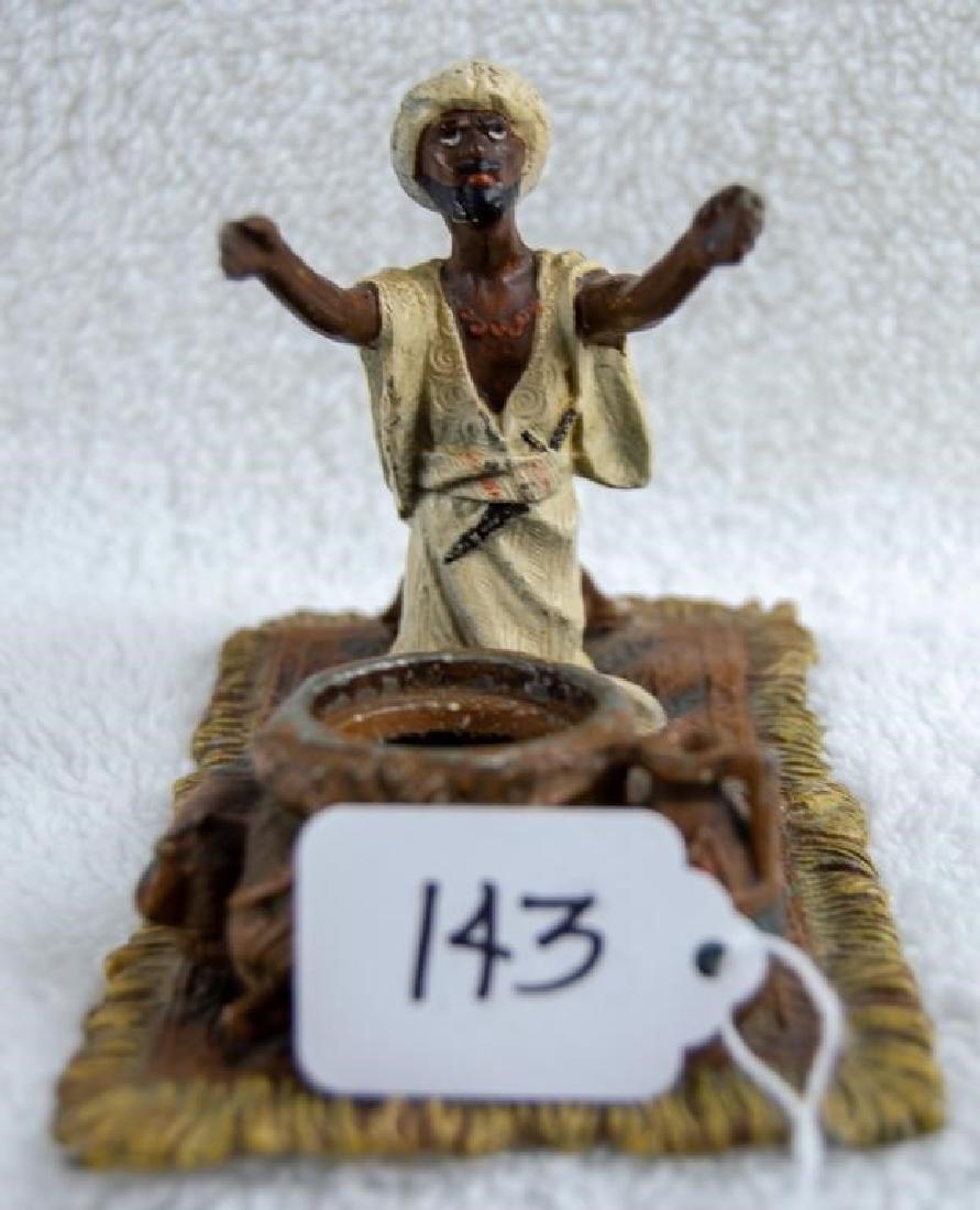 Snake Charmer Ink Well: Snake Charmer Ink Well Vintage snake charmer inkwell. Heavy metal, seems to be lead; 5" x 3.5". Paint shows some wear, especially on bottom. Very good condition.