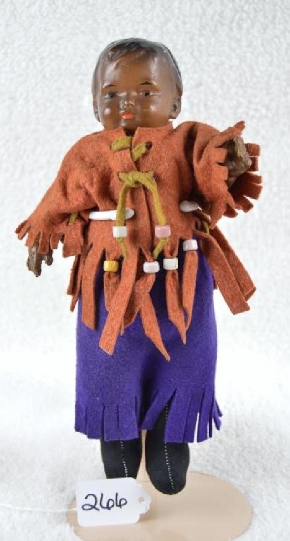 Black Native American Composition Doll: Black Native American Composition Doll 10" Black Native American antique doll; composition head and arms. Doll body is newer material stuffed with straw or straw-like material. Clothes are newer felt.