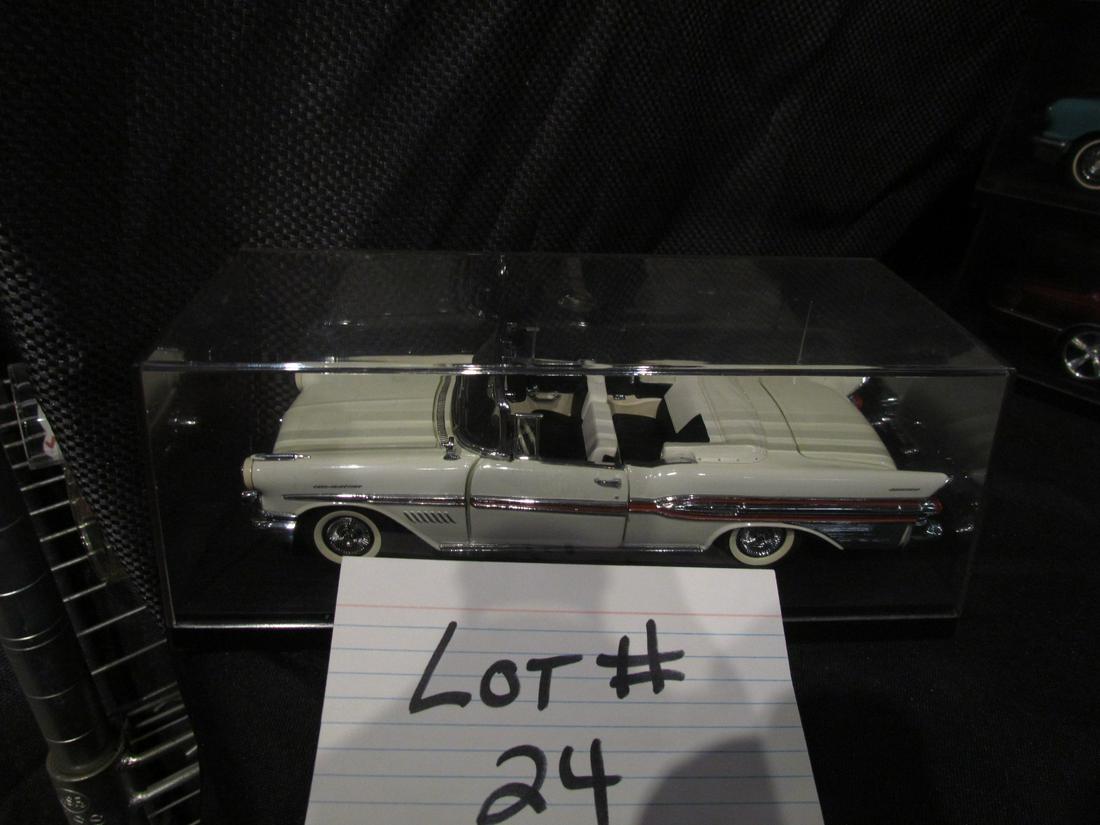 Franklin Mint 1957 Pontiac Bonneville: this is a very nice Franklin Mint 1957 Pontiac Bonneville In Good shape no box but has tag and showcase