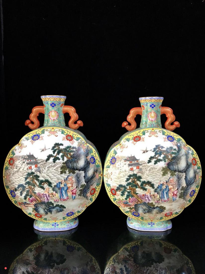 A Pair of Qing Dynasty Enamel Moon Flasks: A nice pair of Chinese enamel moon flasks with double ear handles, painted people with landscapes,with Qianlong Mark.