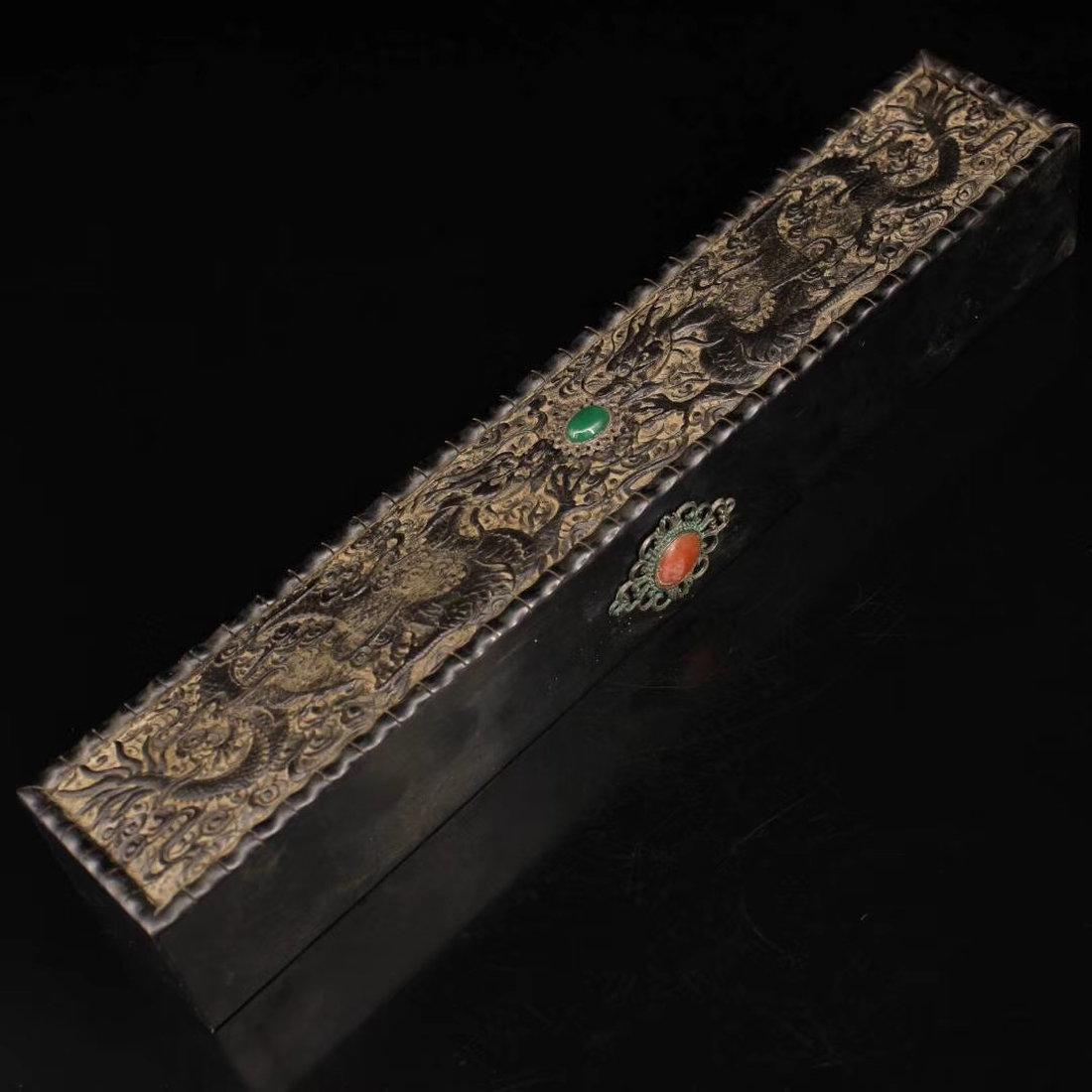 Heitan wood hand carving box: A nice heitan wood hand carving box,set with prescious stones,carved auspicious patterns on the top. Weight: 528 g Dimension: 36x6 cm