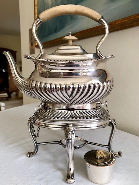 English Silverplate Tea Kettle w/Stand Warmer: English Silverplate Tea Kettle w/Stand Warmer. 9-inches by 6-inches; 12 1/2-inches High. In fine estate condition- looks unused.