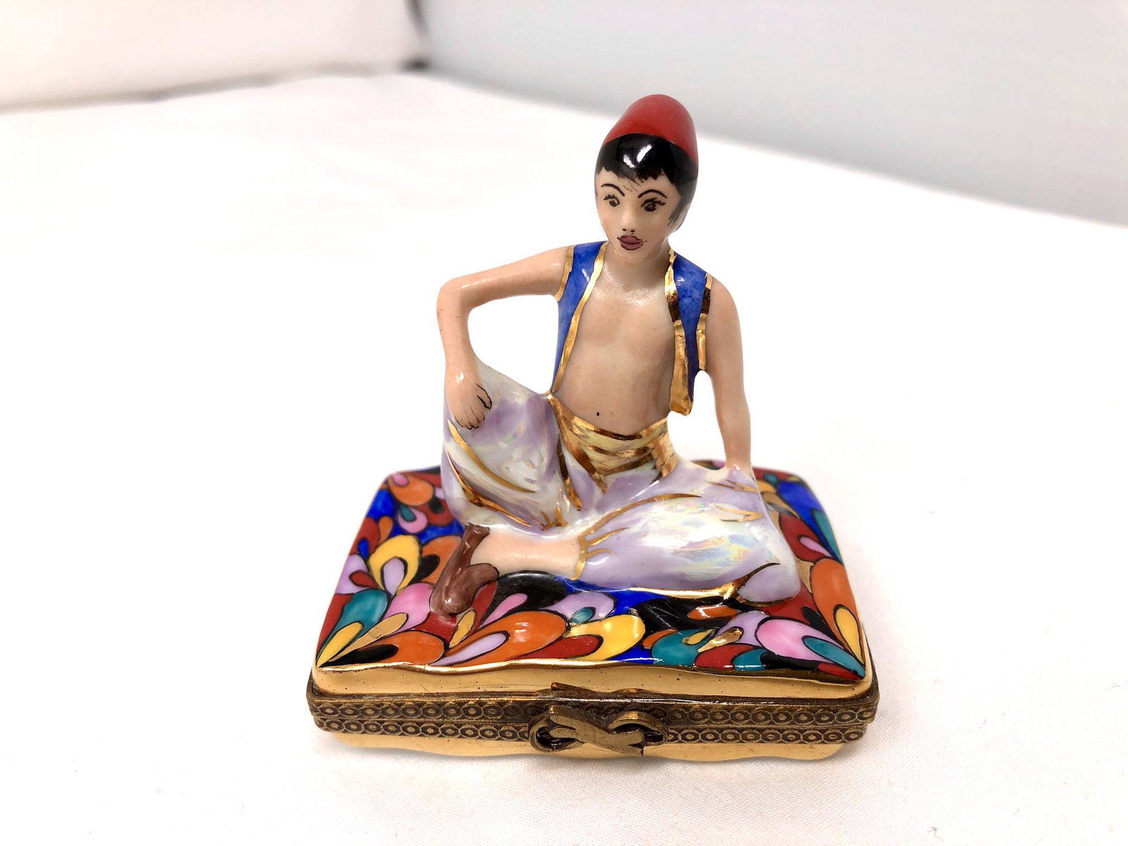 Chanille Peint Main Limoges Genie Trinket Box: Chanille Peint Main Limoges France Genie Trinket Box. Signed Numbered and Handpainted. Approx. 2 1/2-inches by 1 1/2-inches by 2 1/2-inches High. As-is, as-shown.