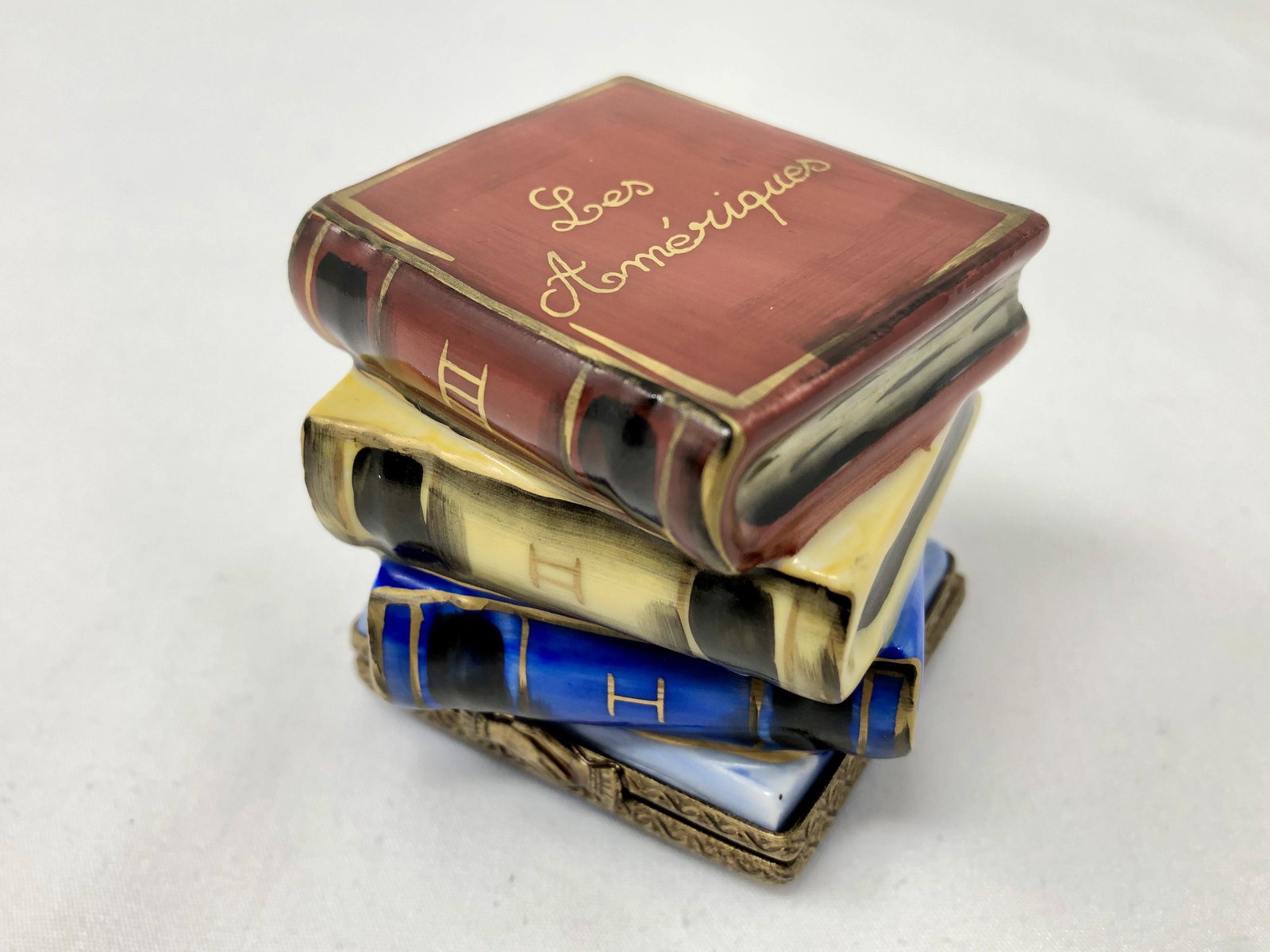Chamart Peint Main Limoges Stack of Books Trinket: Chamart Peint Main Limoges Stack of Books Trinket Box. Handpainted and detailed. Approx. 2 by 1 1/2-inches by 2-inches High. As-is, as-shown.