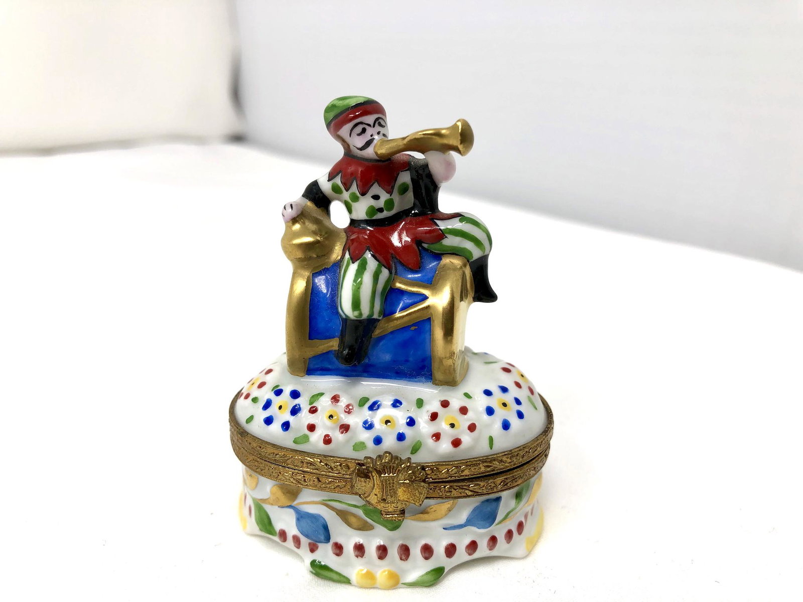 Limoges France Peint Main Court Jester Trinket Box: Limoges France Peint Main Court Jester Trinket Box. Approx. 2 by 1 1/4-inches by 2 3/4-inches Tall. As-is, as-shown.