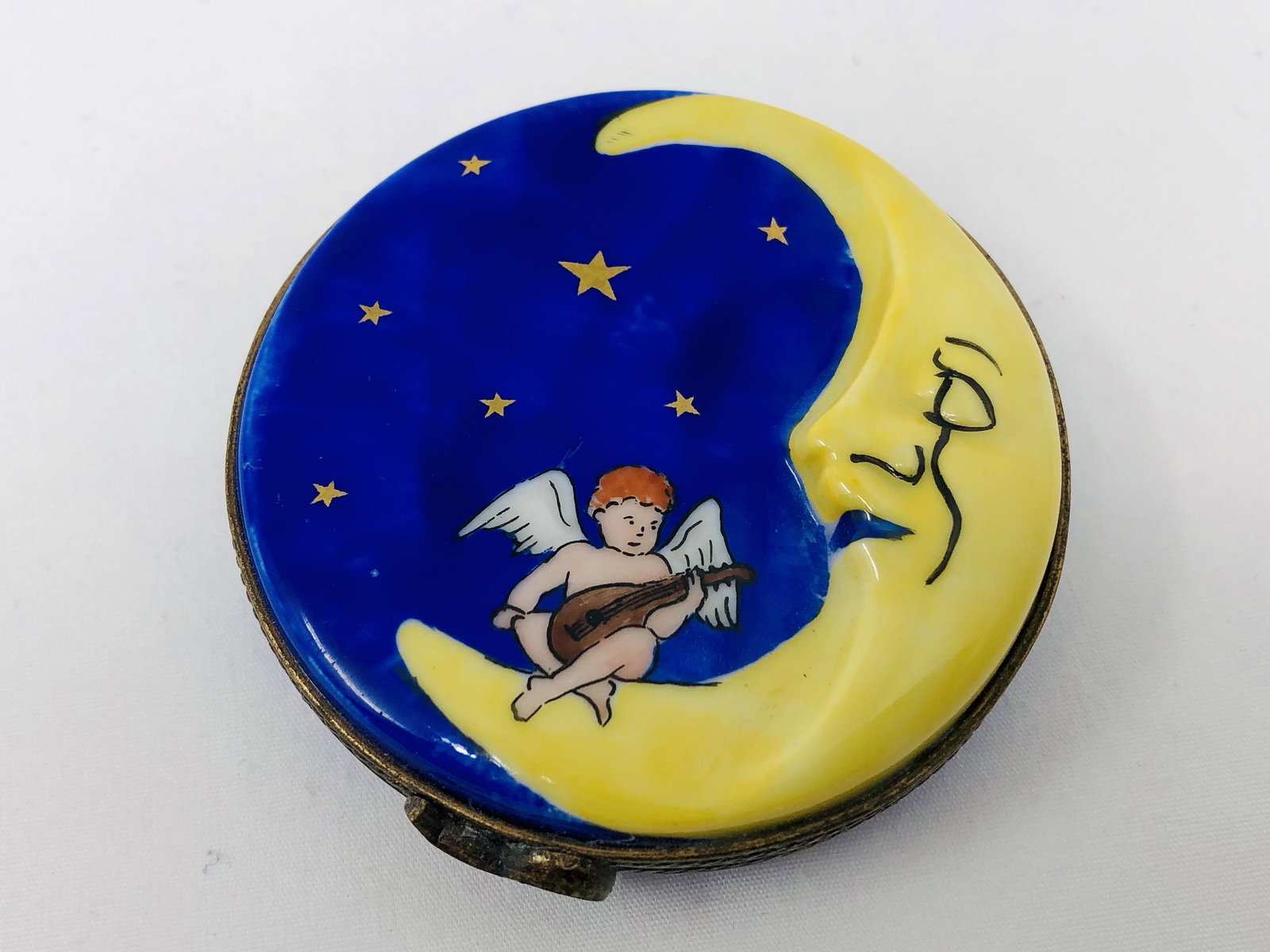 Limoges France Peint Main Angel on the Moon Compact: Limoges France Peint Main Angel on the Moon Compact/Trinket Box. Approx. 2 1/2-inches by 3/4-inches Tall. As-is, as-shown.