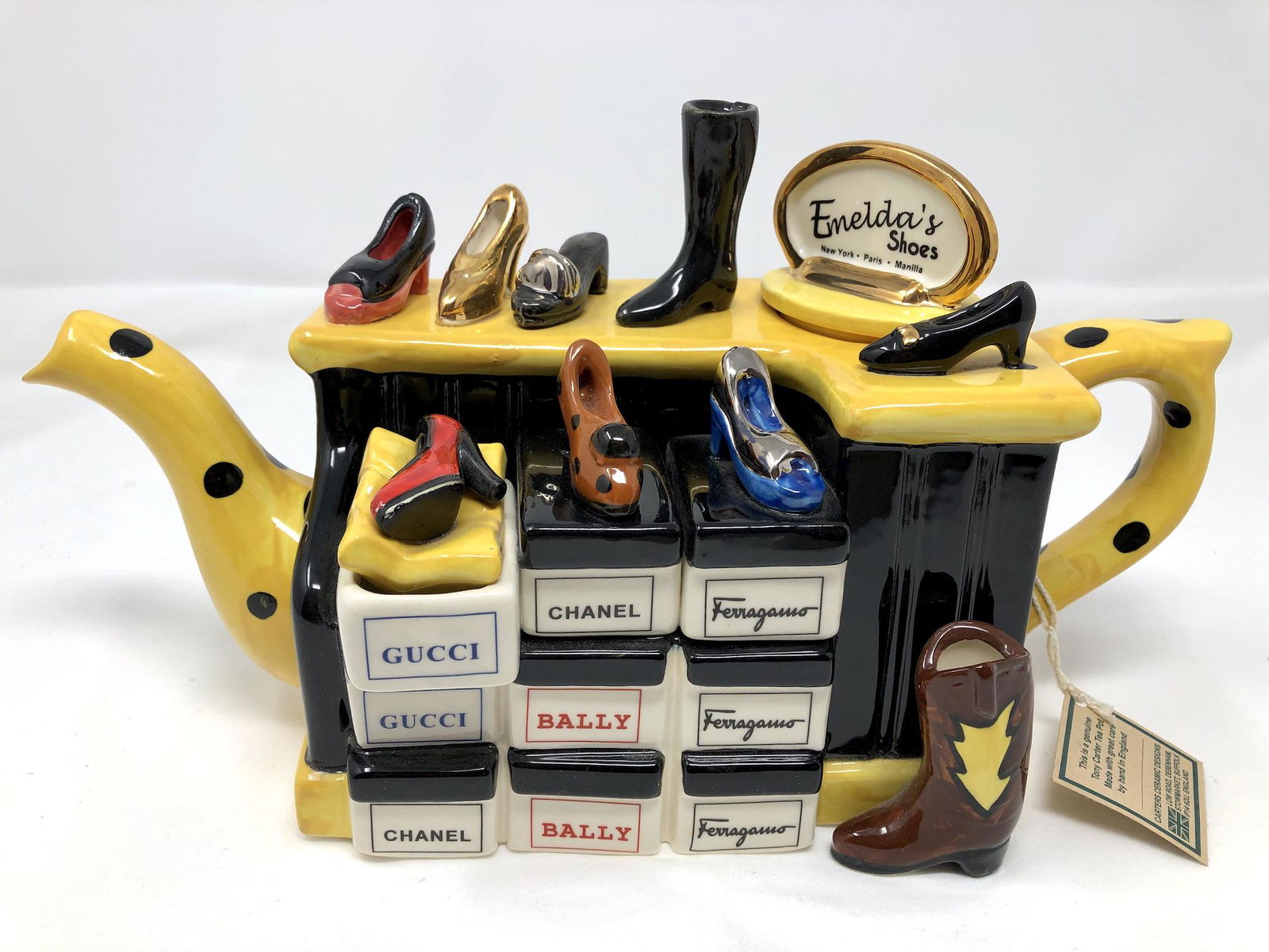 Tony Carter England Emeldas Shoes Designer Fashion: Tony Carter England Emeldas Shoes Designer Fashion Teapot. Numbered Edition Collectors Ceramic Teapot. Approx. 12 inches Long by 5-inches Wide by 7-inches Tall. As-is, as-shown. Original tag still aff