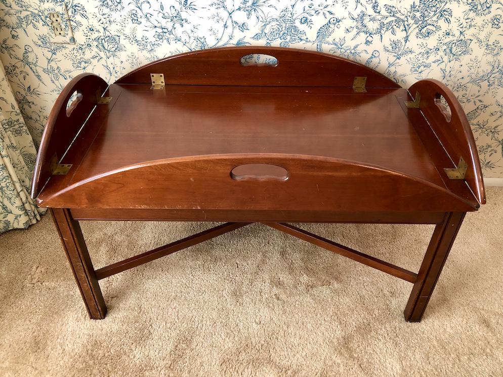 Vintage Mahogany Finish Butlers Tray Oval Coffee Table: Vintage Mahogany Finish Butlers Tray Oval Coffee Table. Circa 1950s. Approx. 22 by 36-inches in dimension folded-in. 17-inches in height. 31 1/4 by 46-inches folded-out. As-Is, As-Shown from an estate