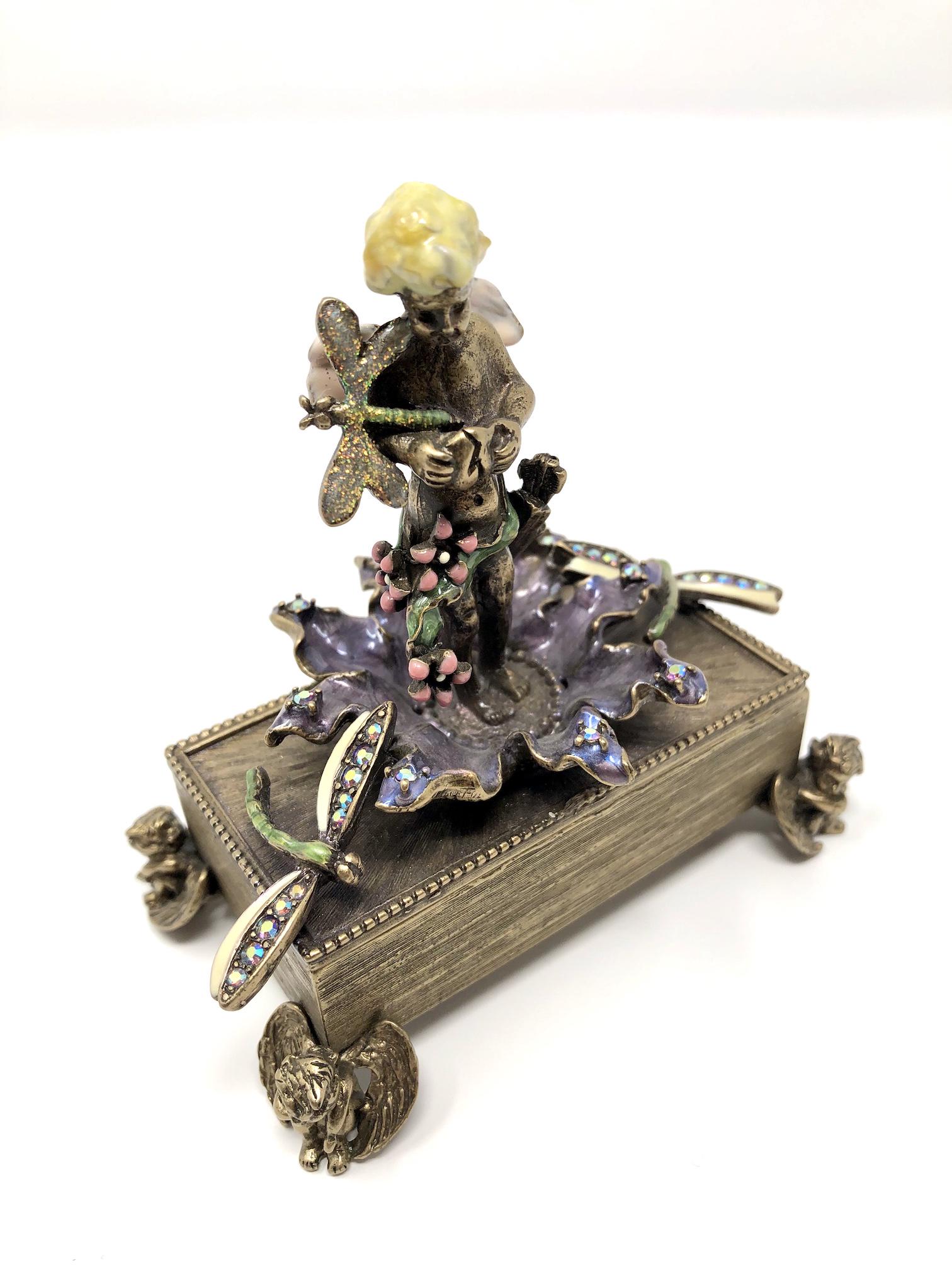 Kirks Folly Enameled Bejeweled Trinket Box: Kirks Folly Enameled Bejeweled Trinket Box. Angles, Cupids, Dragonflies Flowers and More Collectible Miniature. Approximately 4-inches Tall. 2 by 3 1/2-inches in Dimension. In beautiful as-is, as-show