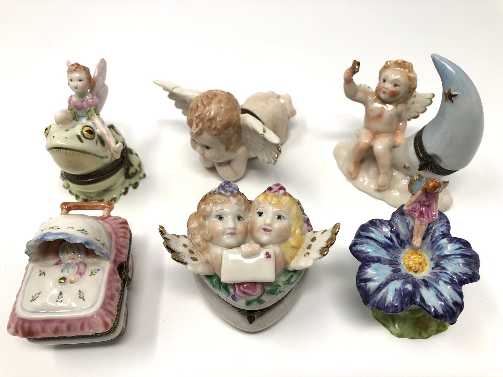 Studio USA Porcelain Trinket Boxes Lot of 6: Studio USA Porcelain Trinket Boxes Lot of 6. Fairies, Angles, Cupids and Baby Themed Hand painted, signed and or marked. Collectible Miniatures. All In beautiful as-is, as-shown collector condition. P