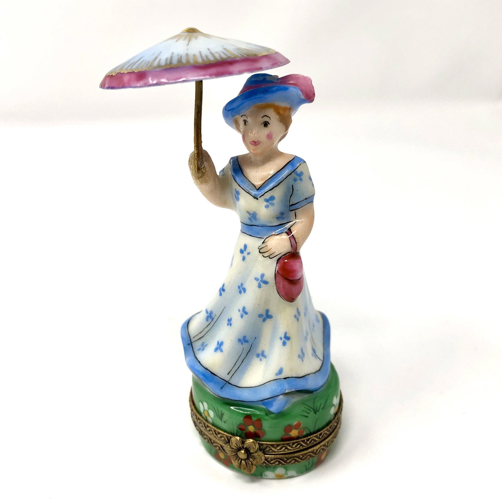 Woman in Dress With Parasol RMC Porcelain Trinket Box: Woman in Dress With Parasol RMC Peint Main Limoges France Porcelain Trinket Box. Numbered Edition, Hand painted, signed and or marked. Approx. 3 1/2-inches Tall by 1 1/4 -inches In Diameter at the Bas