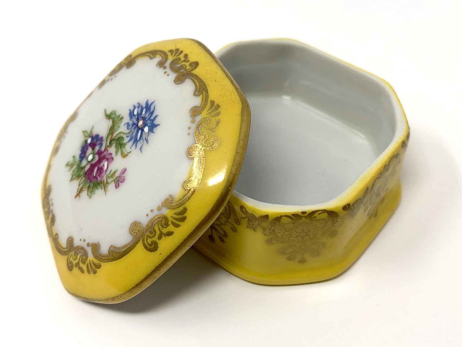 Chamart Porcelain Limoges France Dresser Tinket Box: Chamart Porcelain Limoges France Dresser Tinket Box. Approx. 1 1/8 -inches Tall by 2 by 2-inches In Dimension. In beautiful as-is, as-shown collector condition. Please note all photographs and ask any