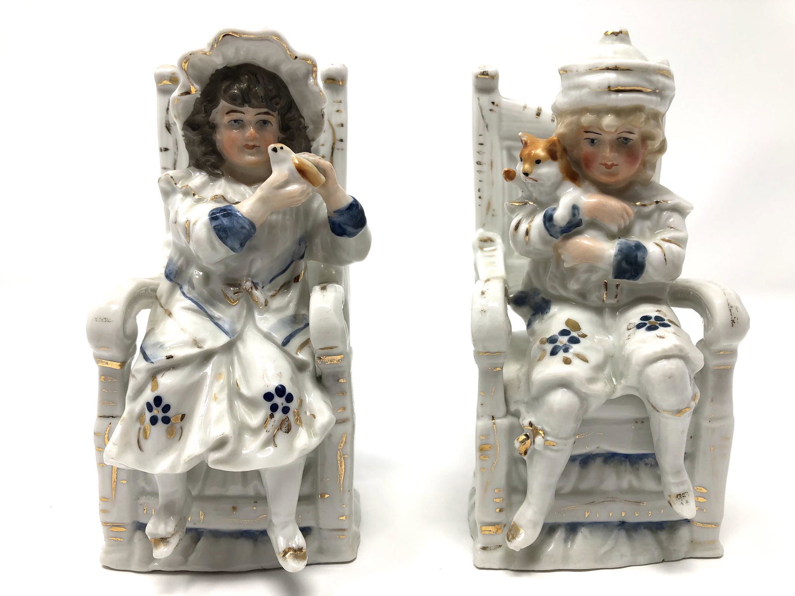 Victorian Porcelain Seated Boy and Girl Pair Set on: Victorian Porcelain Seated Boy and Girl Pair Set on Chair Figurines. Each Approx. 5 1/2 -inches Tall by 2 1/2 by 2 3/4 -inches In Dimension at the Base. In beautiful as-is, as-shown collector conditio