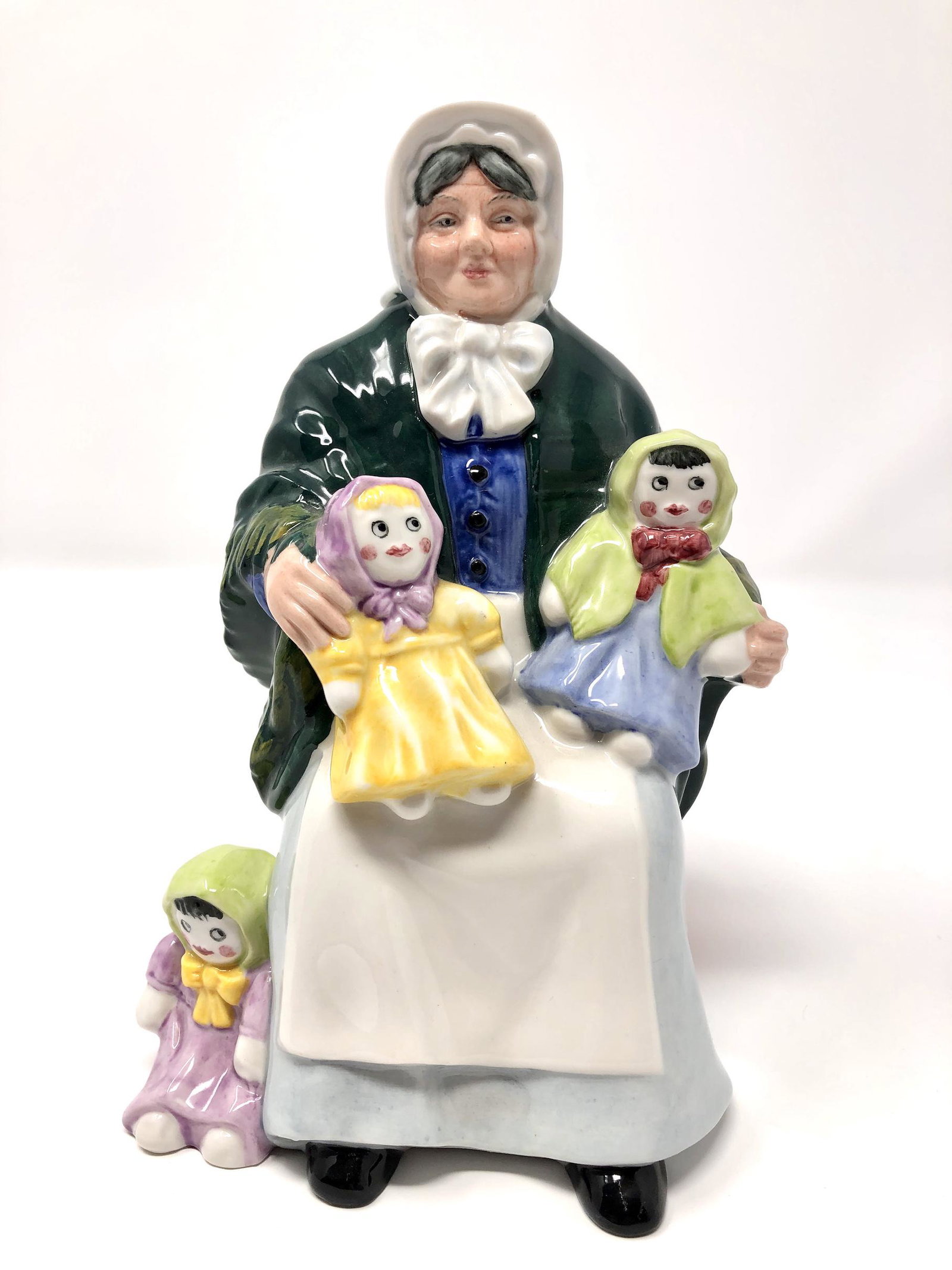 Royal Doulton England The Rag Doll Seller HN 2944: Royal Doulton England The Rag Doll Seller HN 2944 Figurine. Approx. 7-inches Tall by 4 1/2-inches wide. In beautiful as-is, as-shown collector condition. Please note all photographs and ask any questi