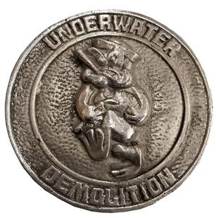 Underwater Demolition Aluminum Plaque: Contemporary cast aluminum plaque of the famed Underwater Demolitions divers. Piece is approximately 6-3/4" in diameter.