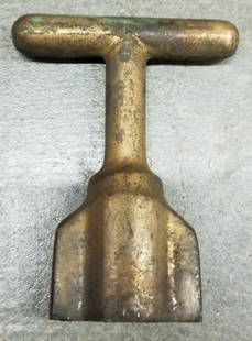 Mark V Helmet Tee Wrench For Wing Nut Removal: Solid brass Tee wrench in configuration for US Navy Mark V wing nuts. This type of wrench is used to tighten and loosen the 12 wing nuts on a Mark V helmet. Nice piece to display with a helmet.