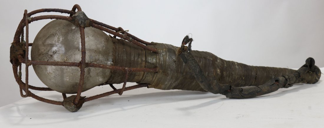 Antique Underwater Torch Lite Lamp w/ Old Cage Style: There is no doubt this torch has lit the way for a diver on many jobs decades ago! This underwater lite measures 21 inches long and the cage at the widest point is 6 inches. A GE underwater divers bul