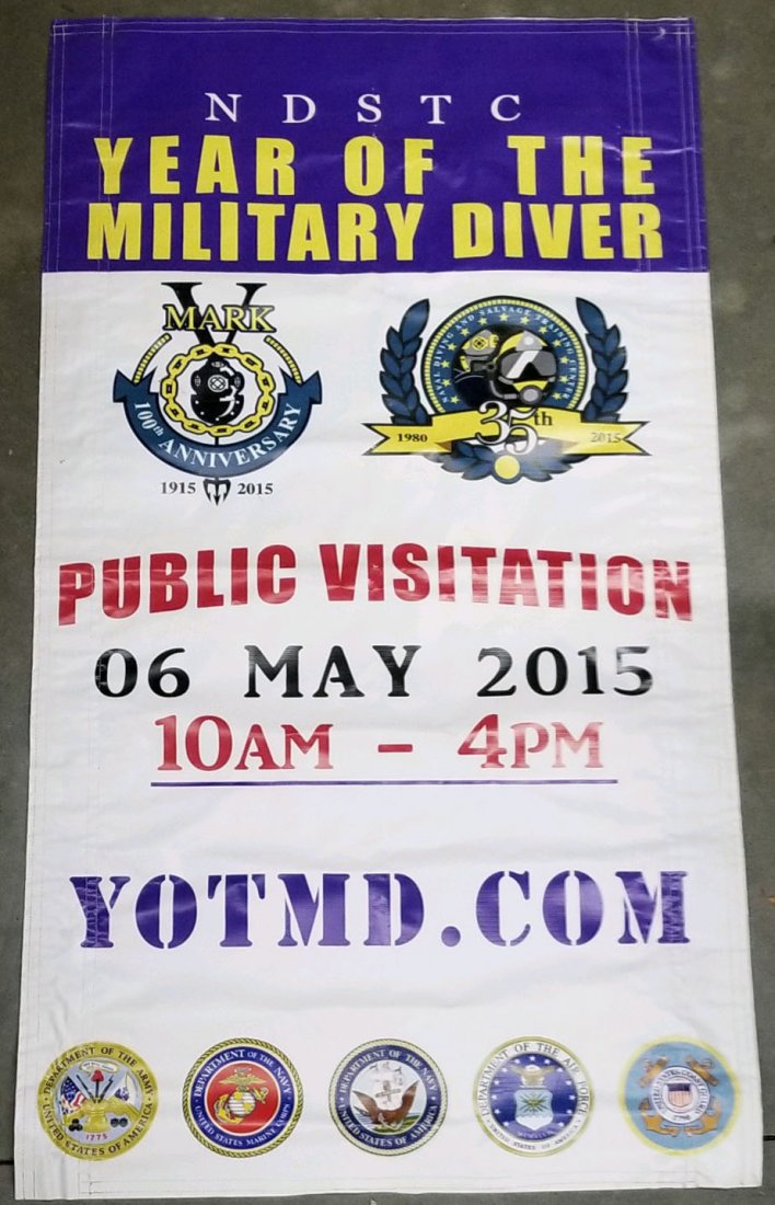 Year Of The Military Diver 100th Anv. of Mark V Banner: Military Diver 100th Anniversary of Mark V Banner Impressive vinyl banner from 2015 for the NDSTC Year Of The Military Diver event. This banner is double sided and measures 64 inches tall and 35 inche